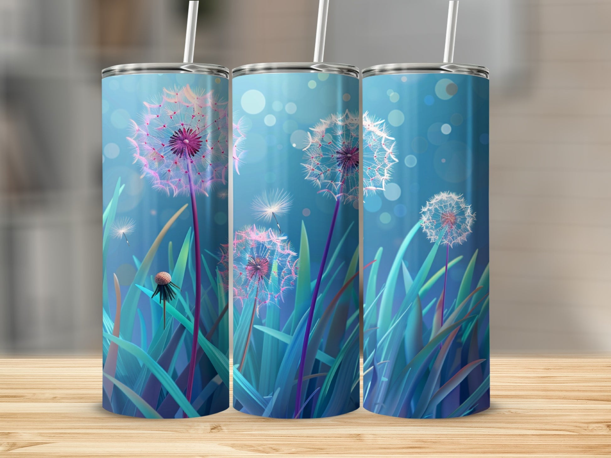 Three tumblers with dandelion illustrations on a wooden surface.