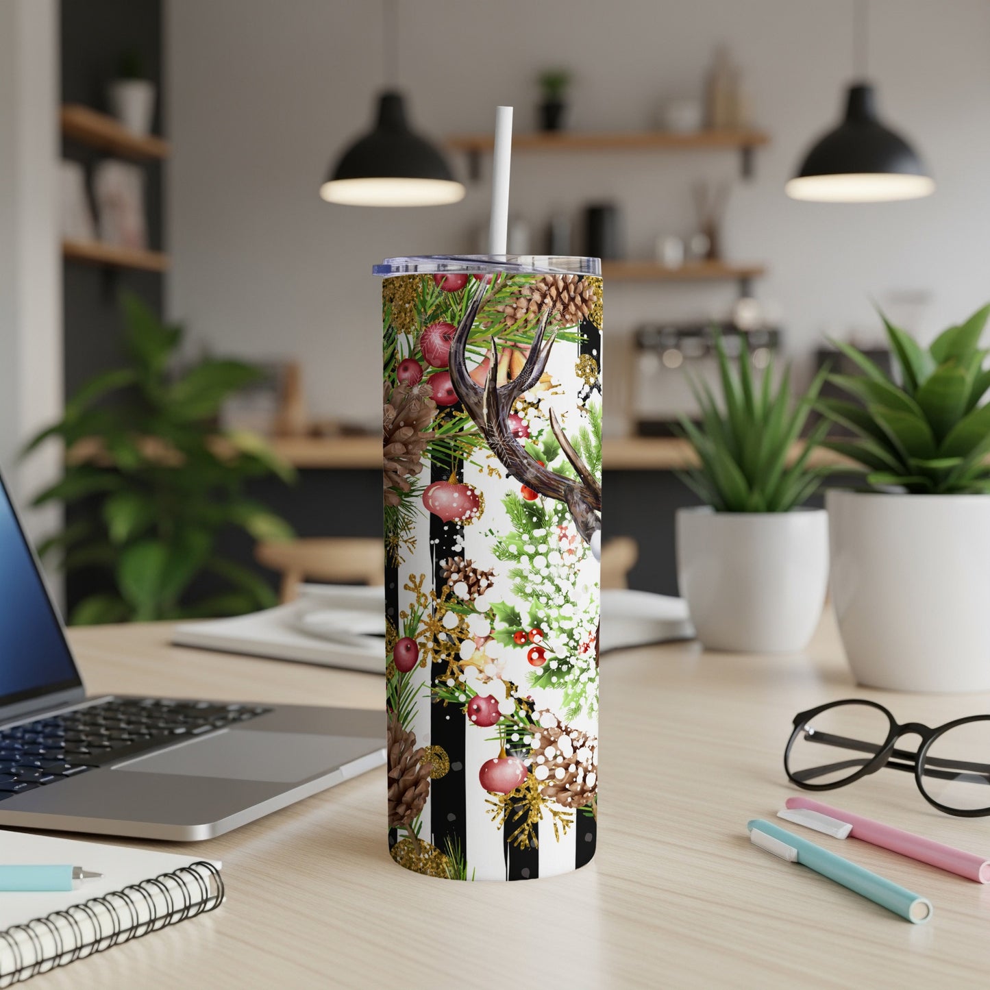 Tumbler with a black and white striped pattern and a festive Christmas design.