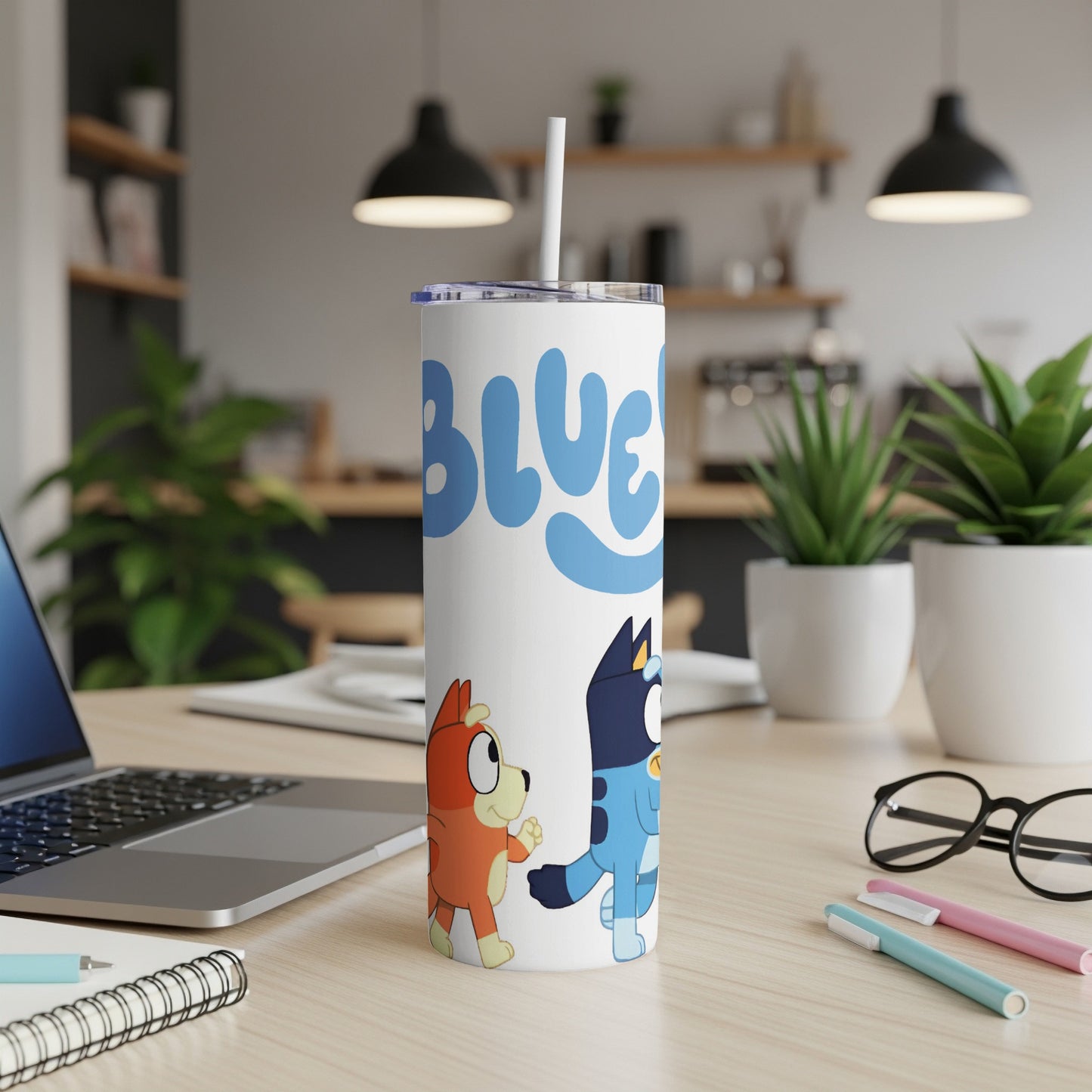 Bluey and Bingo characters on a white tumbler with a straw.