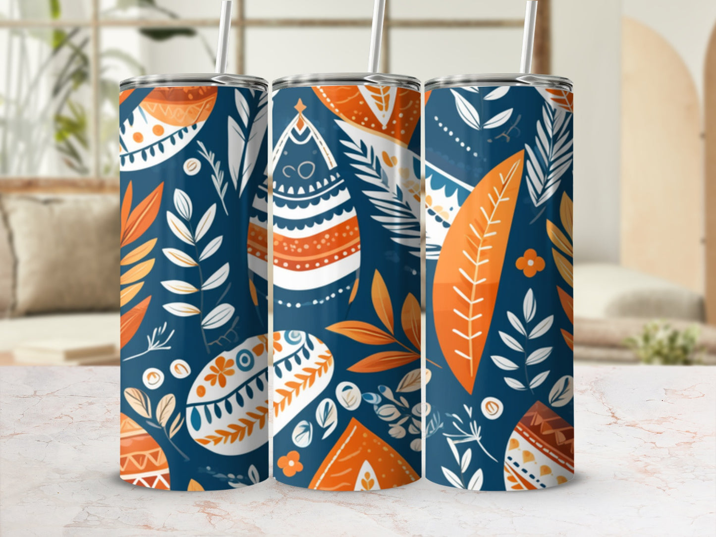 Three tumblers with a boho folk art pattern of leaves and abstract shapes.