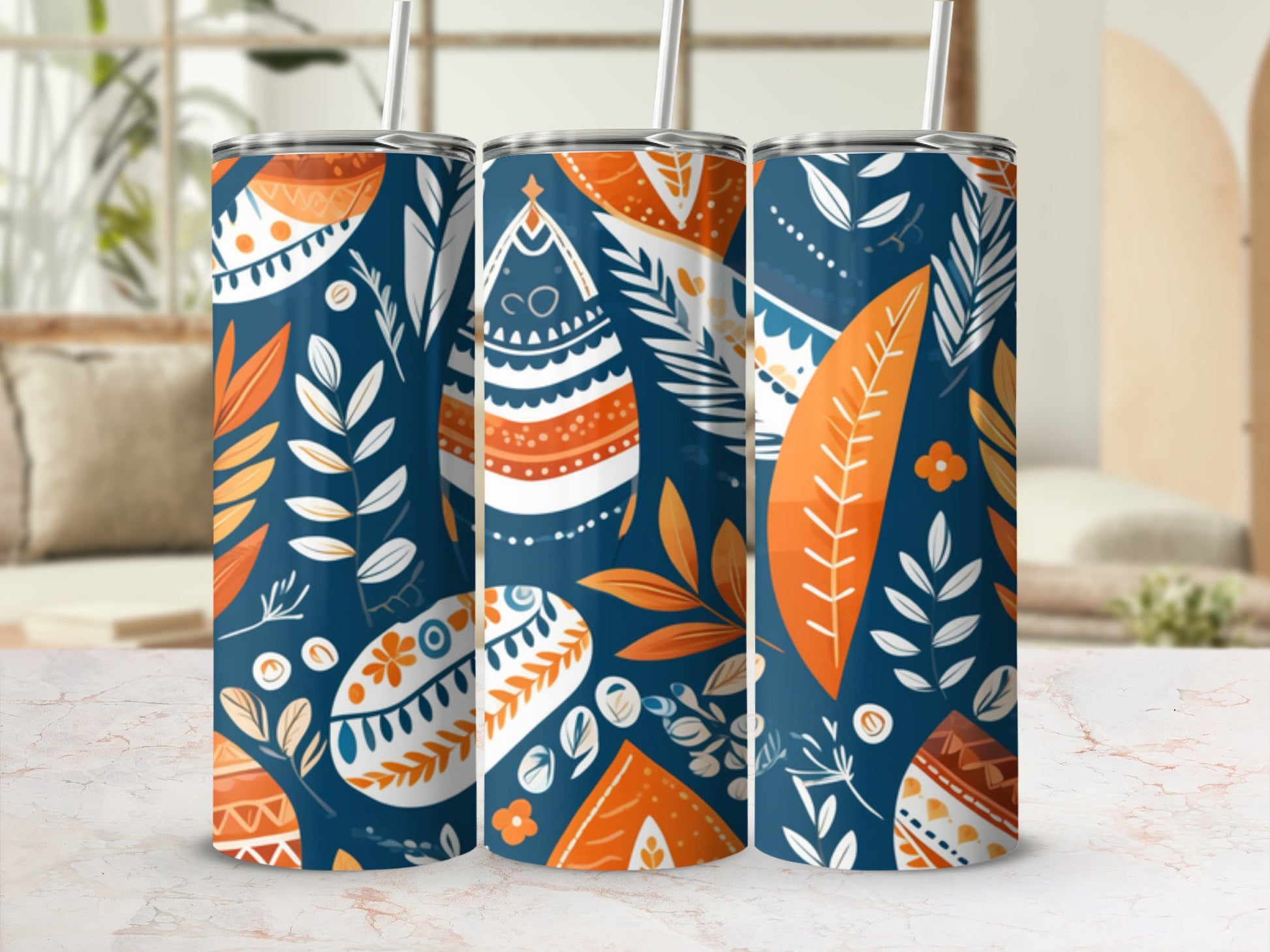 Three tumblers with a boho folk art pattern of leaves and abstract shapes.