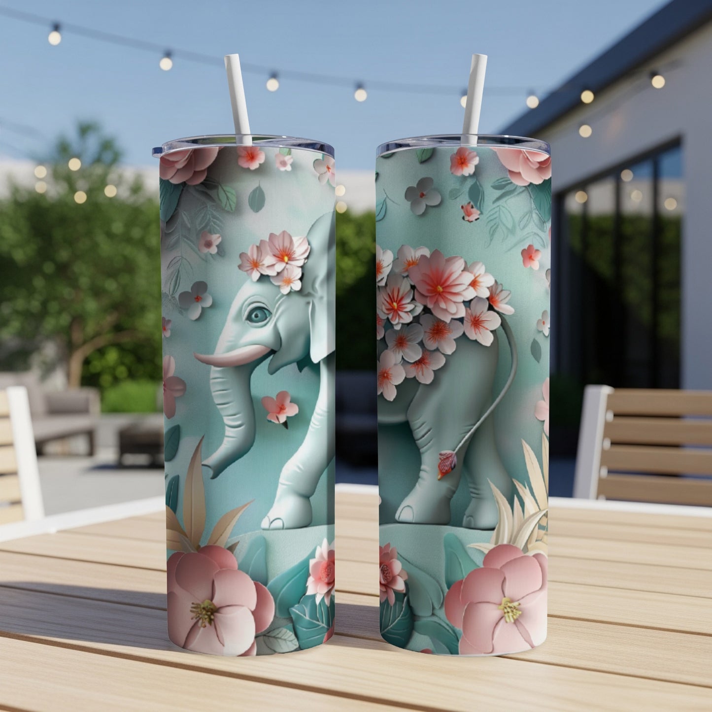 Teal tumbler with floral elephant design.