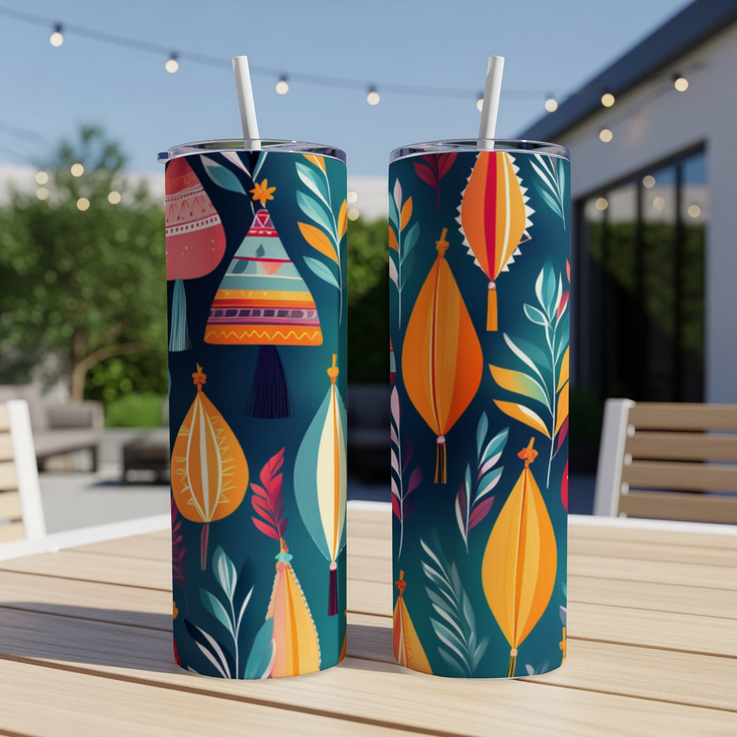 Two dark blue tumblers with colorful abstract patterns and leaves.