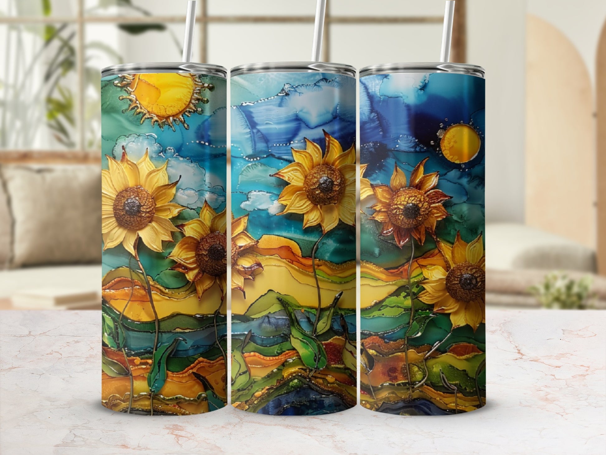 Three tumblers with sunflowers and abstract landscape designs.