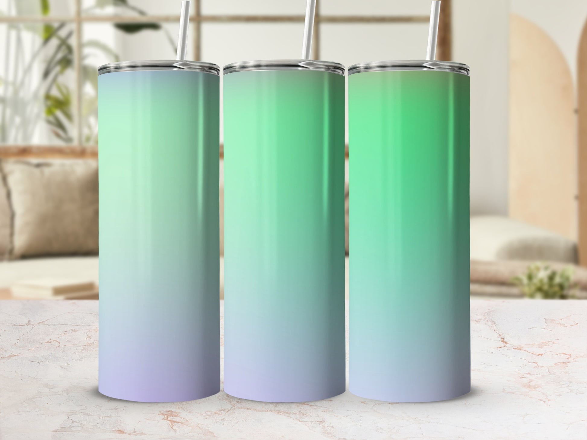 Three tumblers with silver lids and straws, featuring a gradient from green to purple.