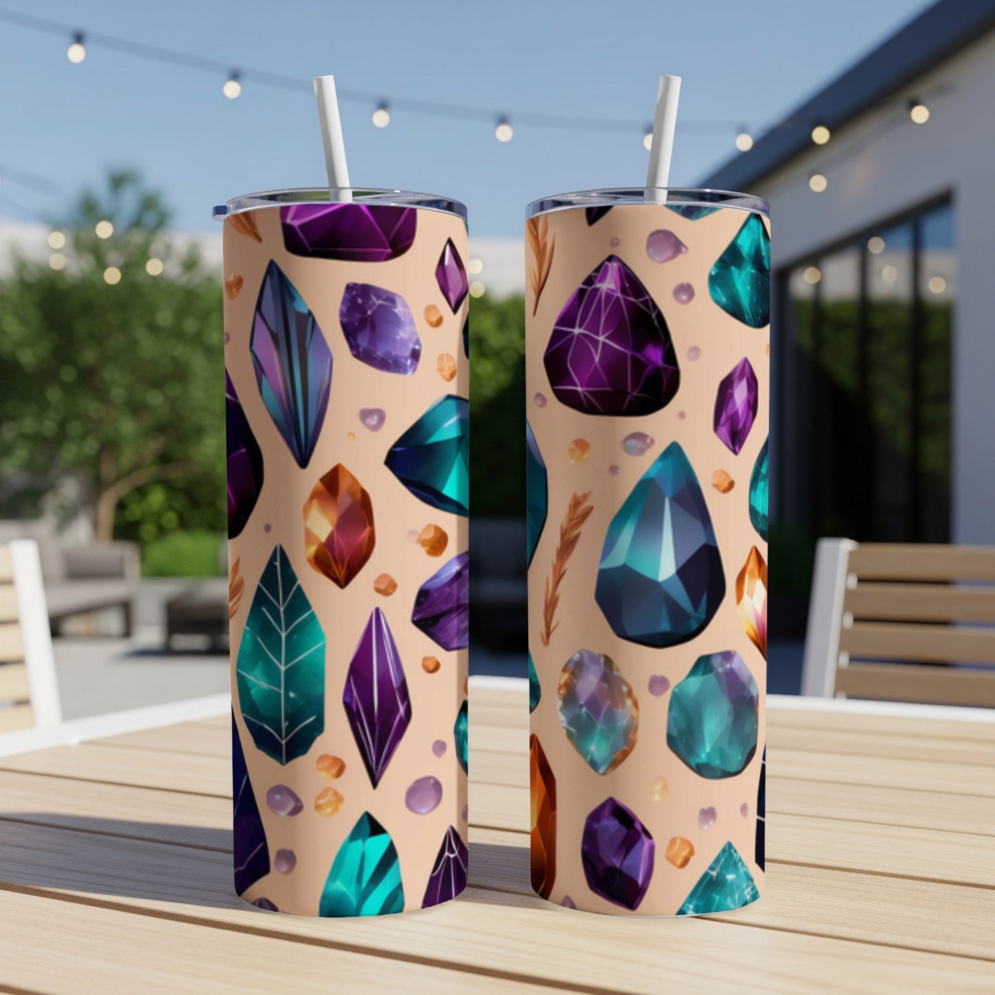 Two tumblers with a colorful crystal and feather pattern.