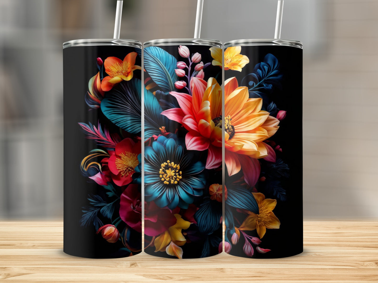 Two black tumblers with a vibrant floral design, featuring red, orange, and blue flowers.
