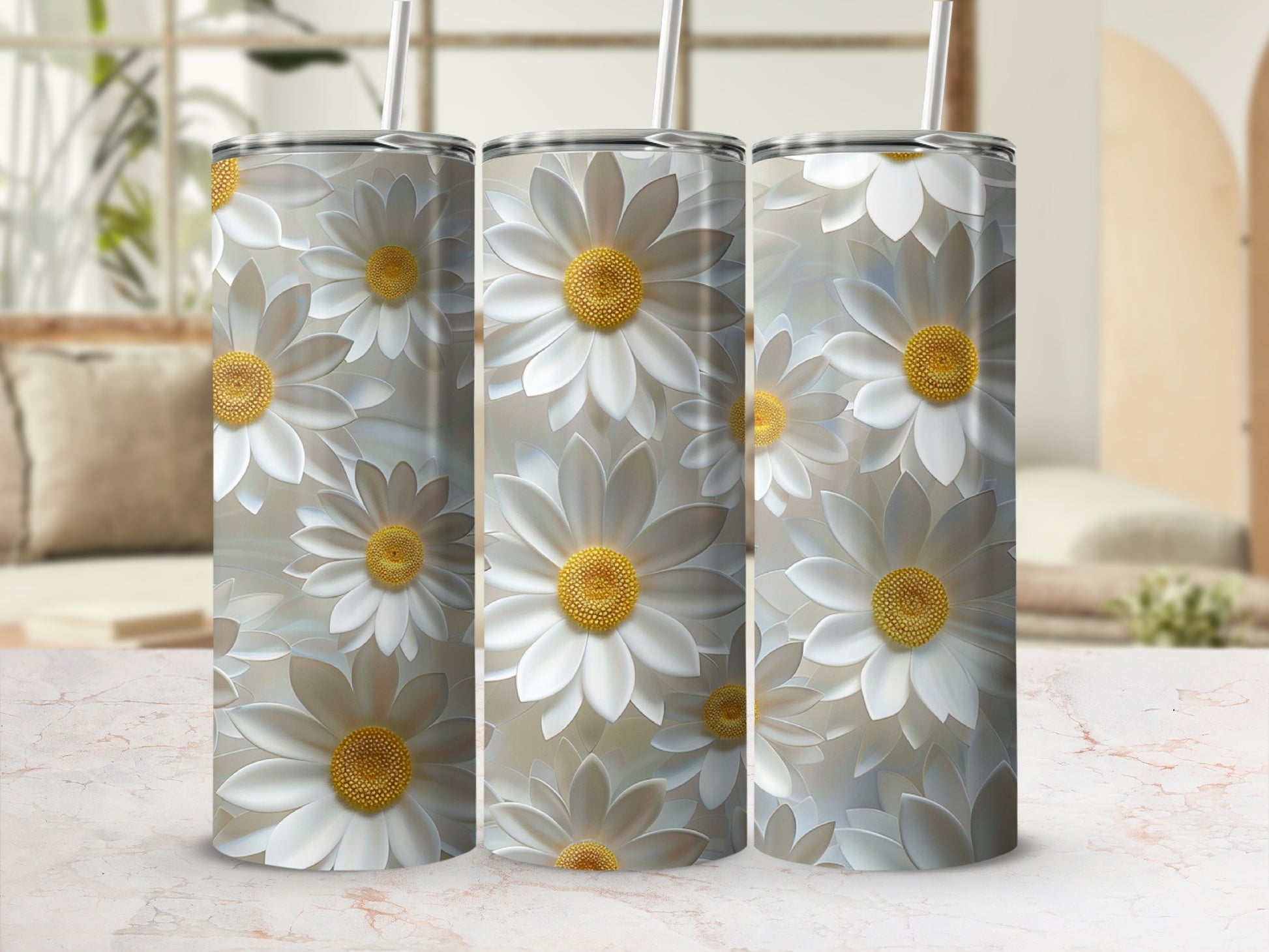 Three tumblers featuring a repeating pattern of white daisies with yellow centers.