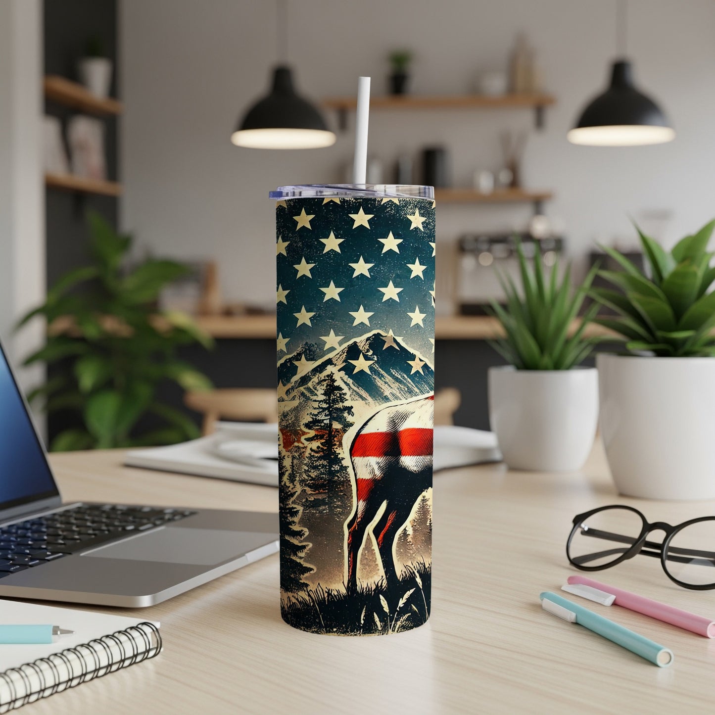 Tumbler with deer, mountains, and American flag design.