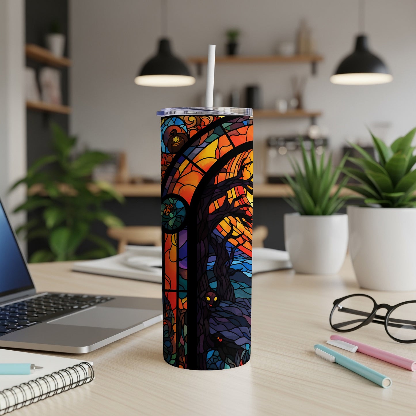 Stained glass tumbler with spooky tree and creatures design.