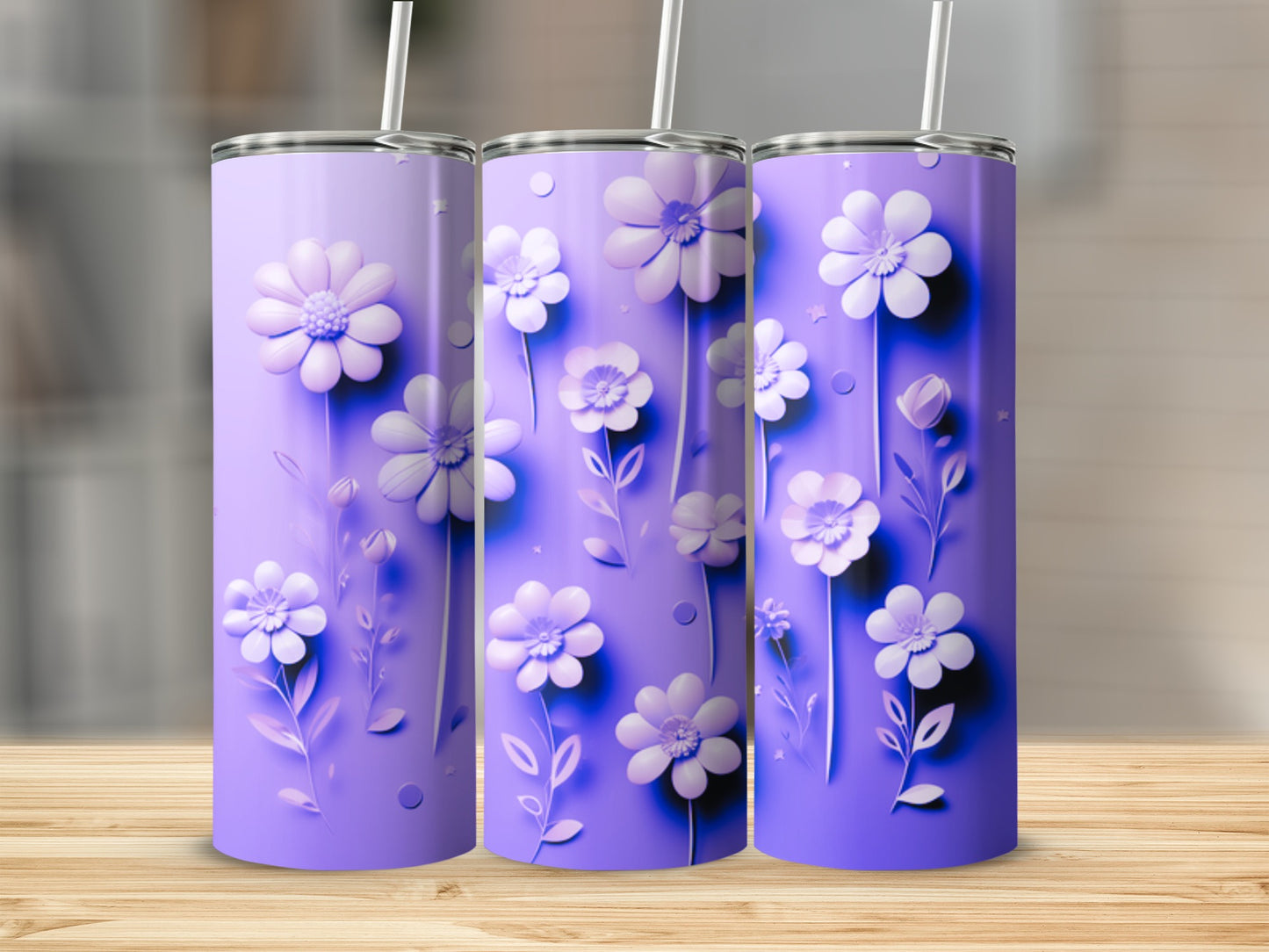 Three purple tumblers with raised white floral designs and straws.