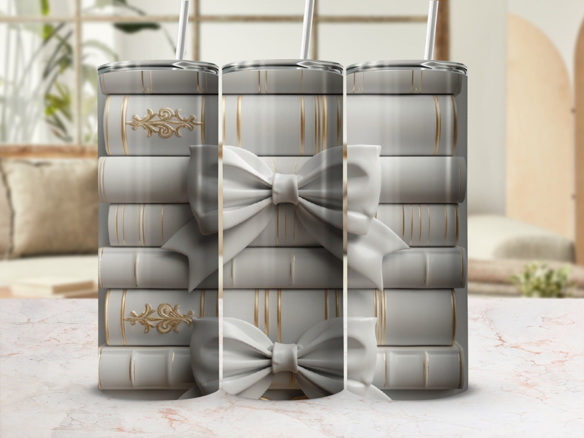Stack of white tumblers with gold ribbon and bow details.