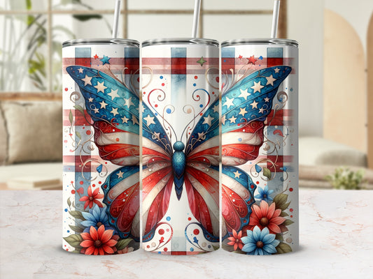 Tumbler with patriotic butterfly and floral design on a marble surface.