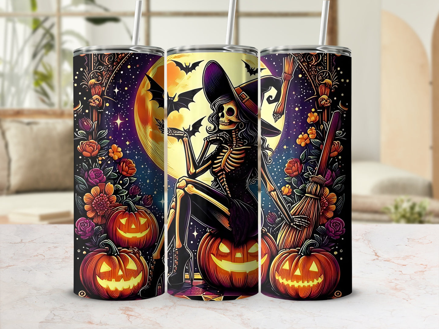 Three tumblers with Halloween skeleton witch and jack-o'-lantern designs.