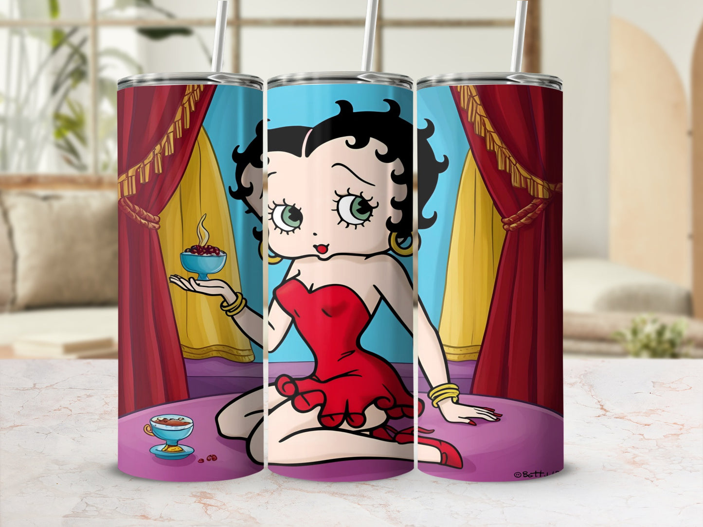 Betty Boop in red dress holding coffee cup with cherries, sitting on a cushion.