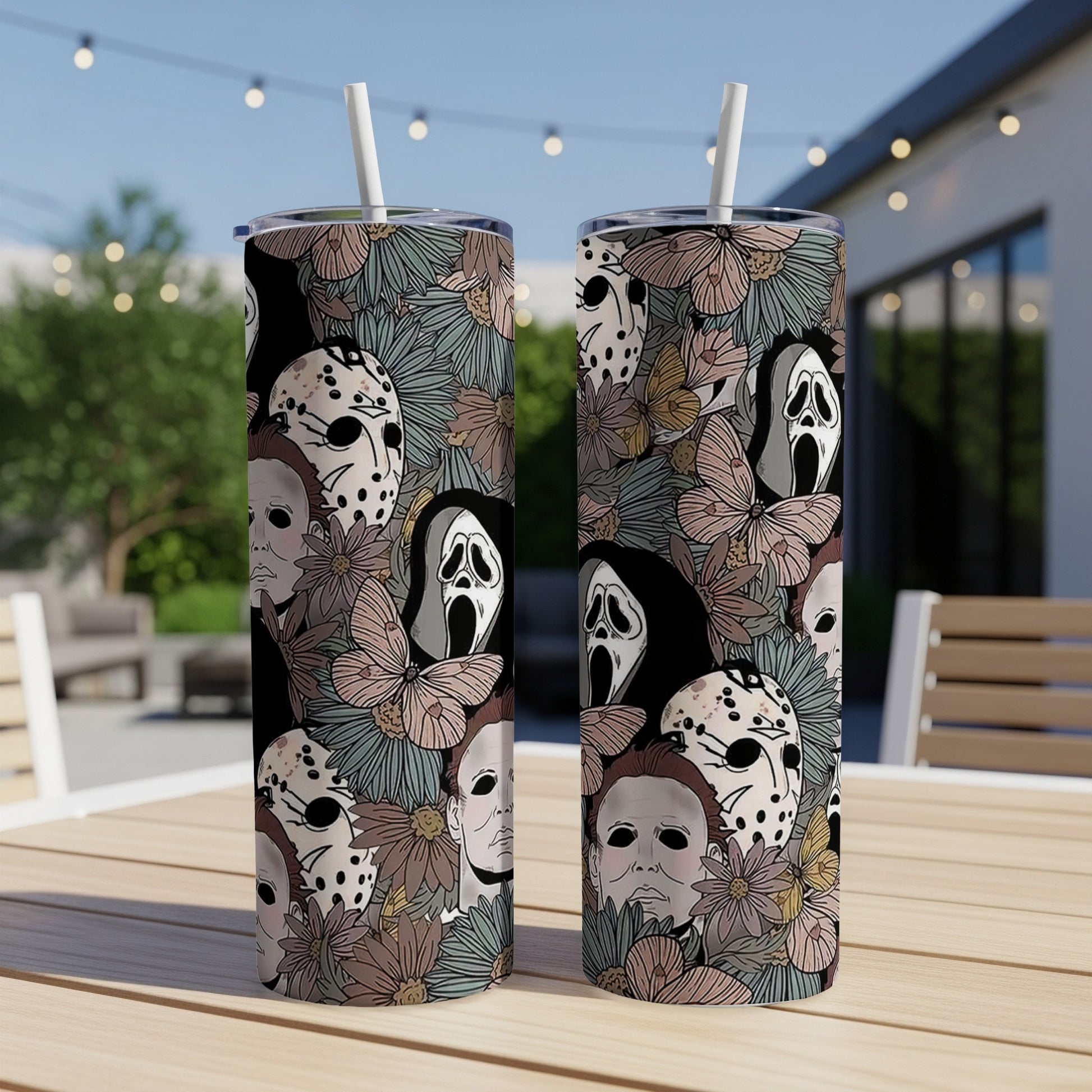 Two tumblers with horror movie character masks and floral pattern.