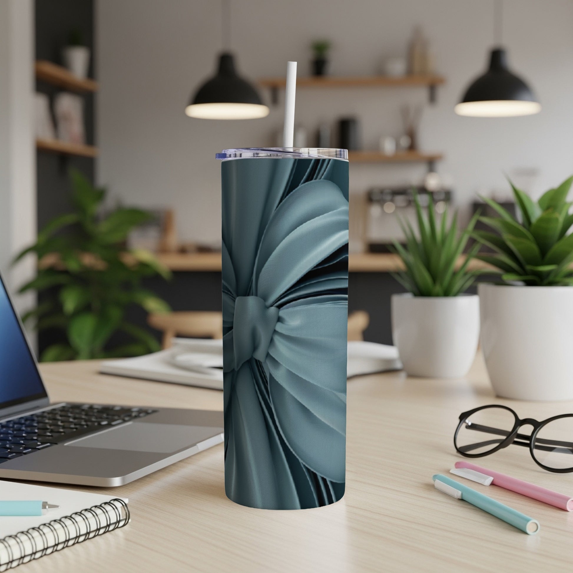 Blue metallic ribbon pattern on a tall tumbler with a straw.