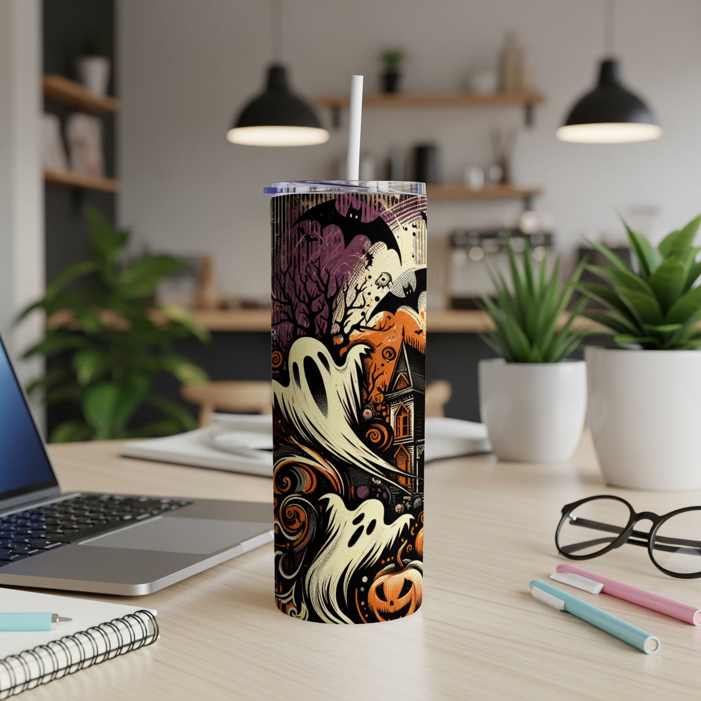 Halloween tumbler with ghosts, bats, pumpkin, and haunted house design.