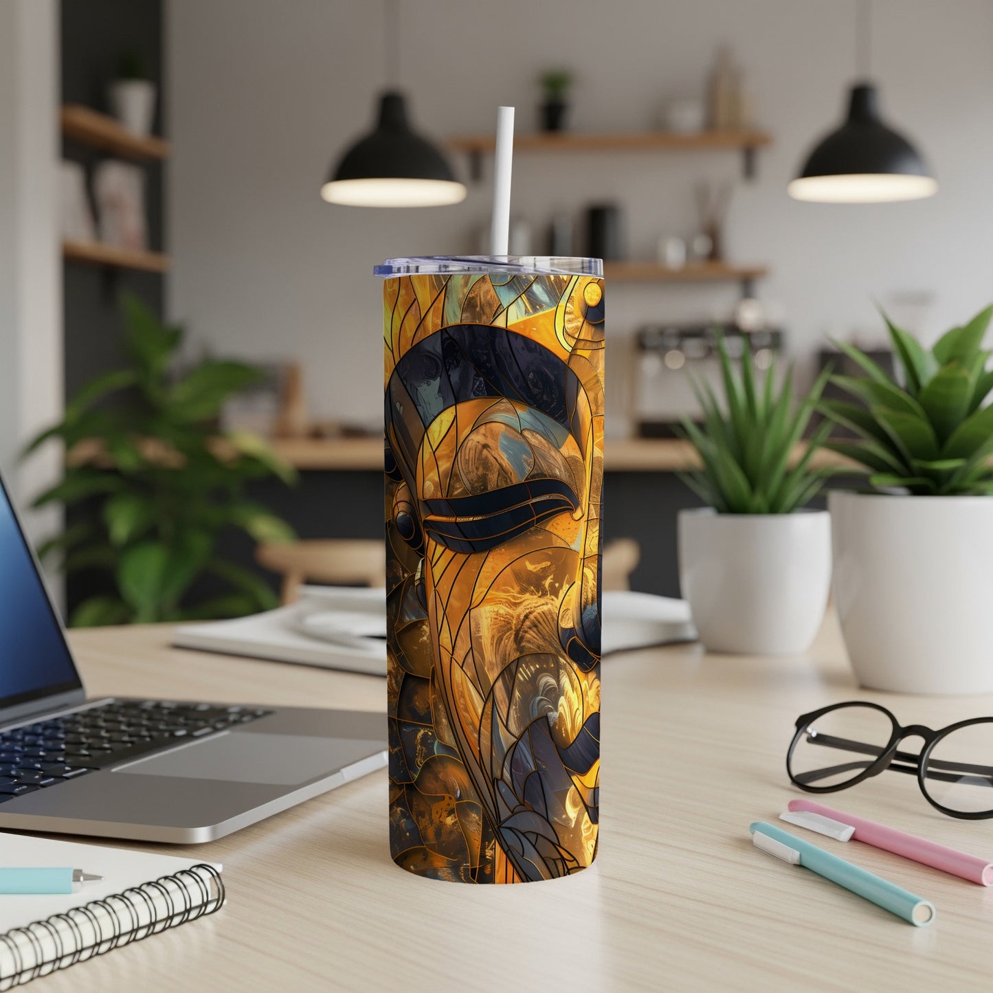Tall tumbler with a mosaic-like abstract design featuring golden and dark hues.