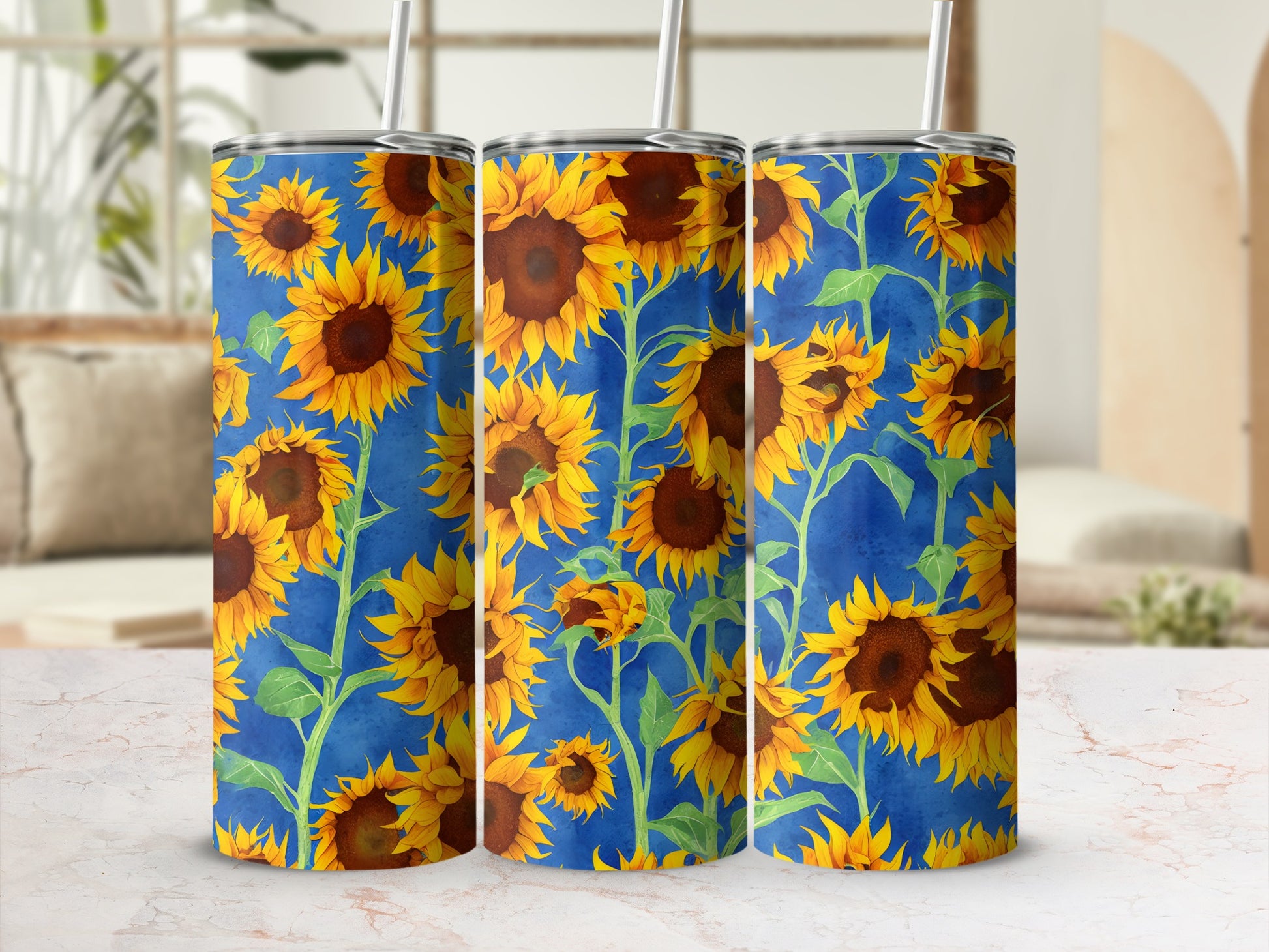 Blue tumbler with a repeating pattern of yellow sunflowers and green leaves.