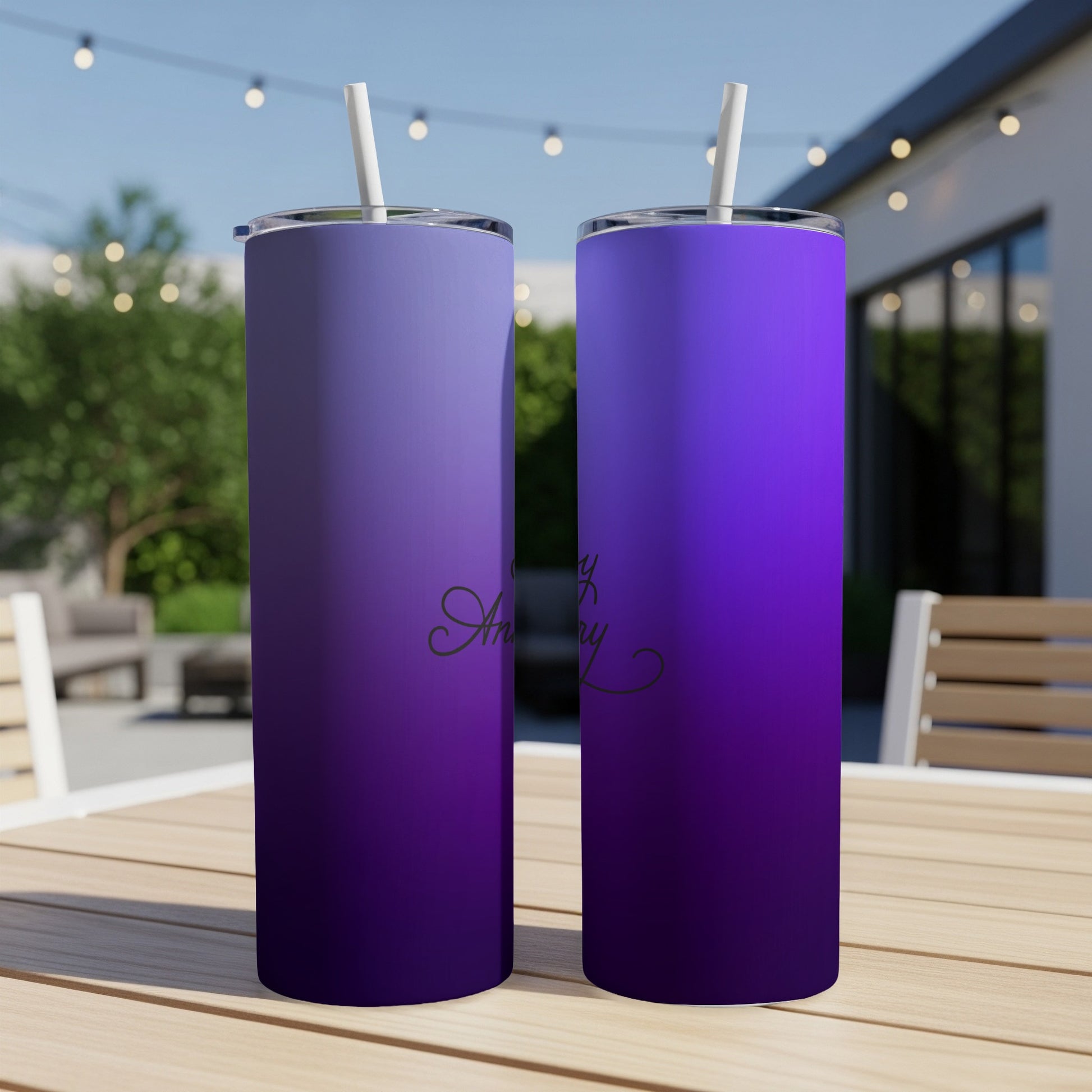 Two purple gradient tumblers with "Happy Anniversary" text sit on a table.