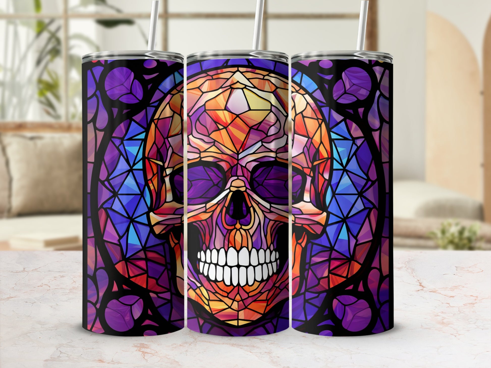 Stained glass skull design on a tumbler with straws.