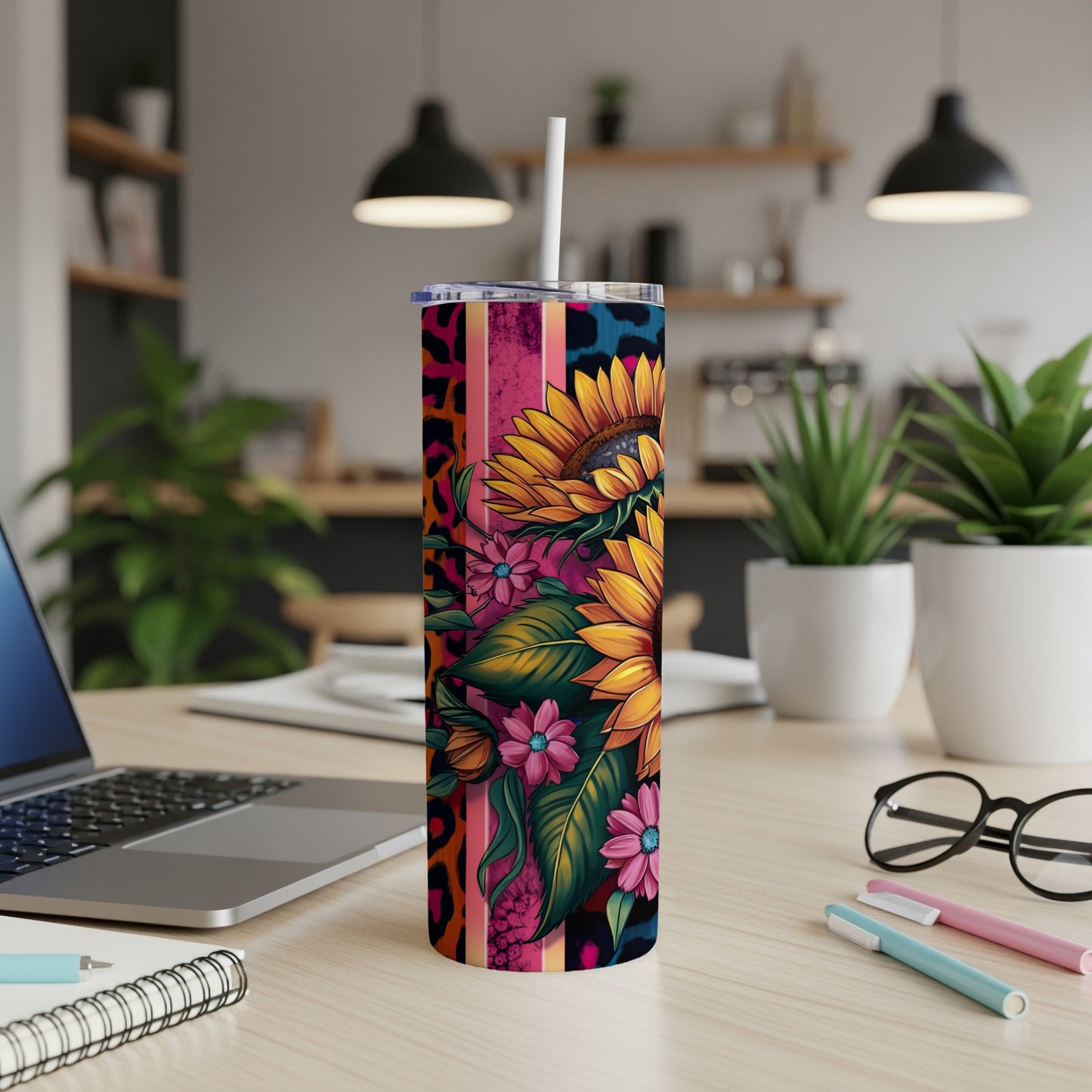 Sunflower and floral design on a pink, blue, and leopard print tumbler.
