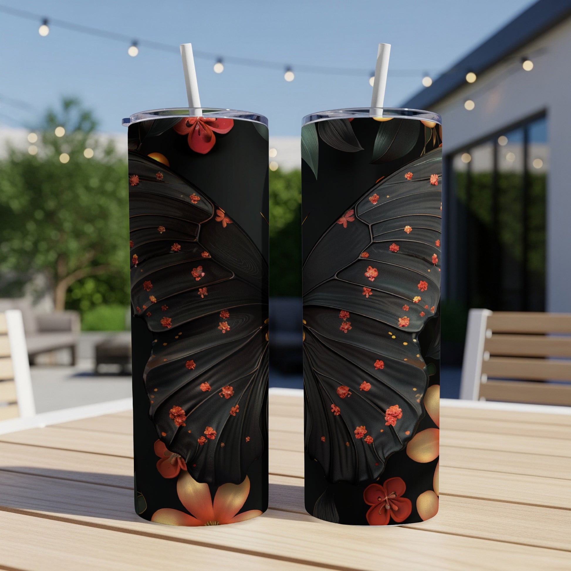 Two tumblers with a black butterfly wing and floral design.