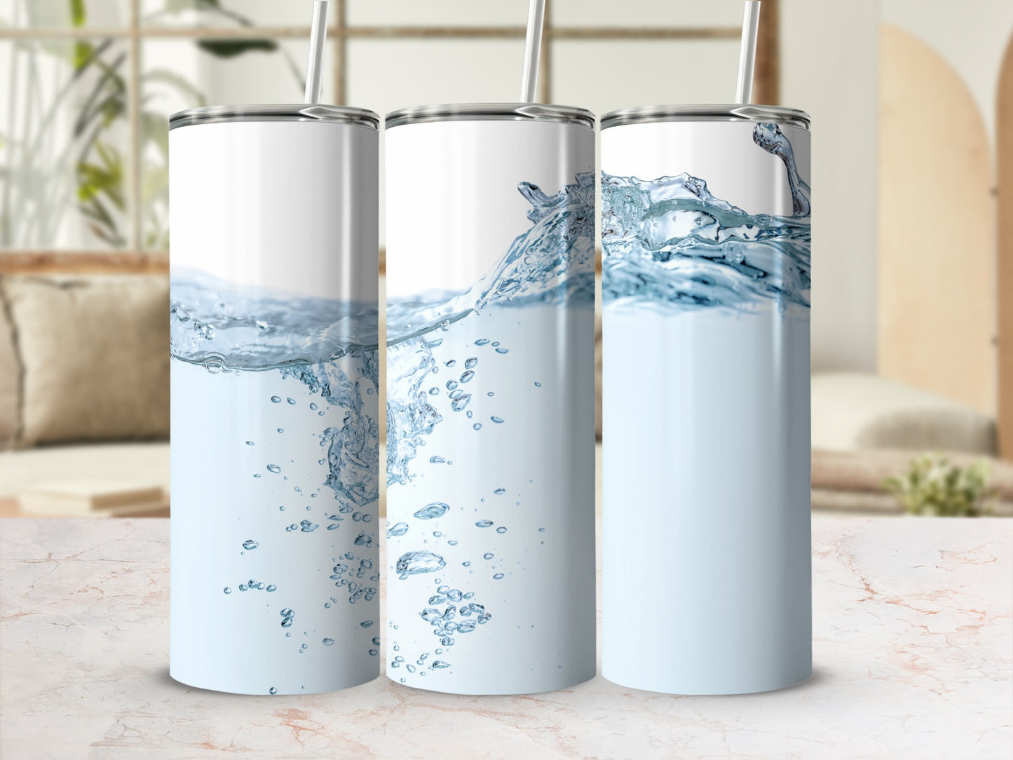 Three tumblers with water splashes and bubbles, presented in a studio setting.