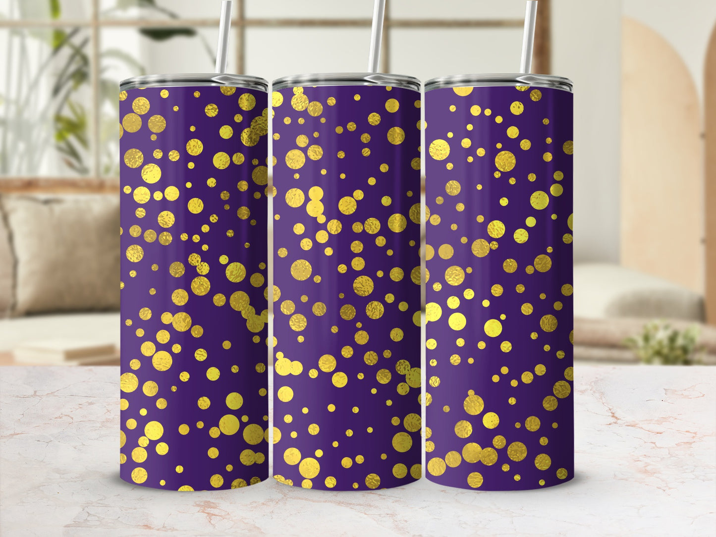 Three purple tumblers with gold polka dot pattern, each with a straw.