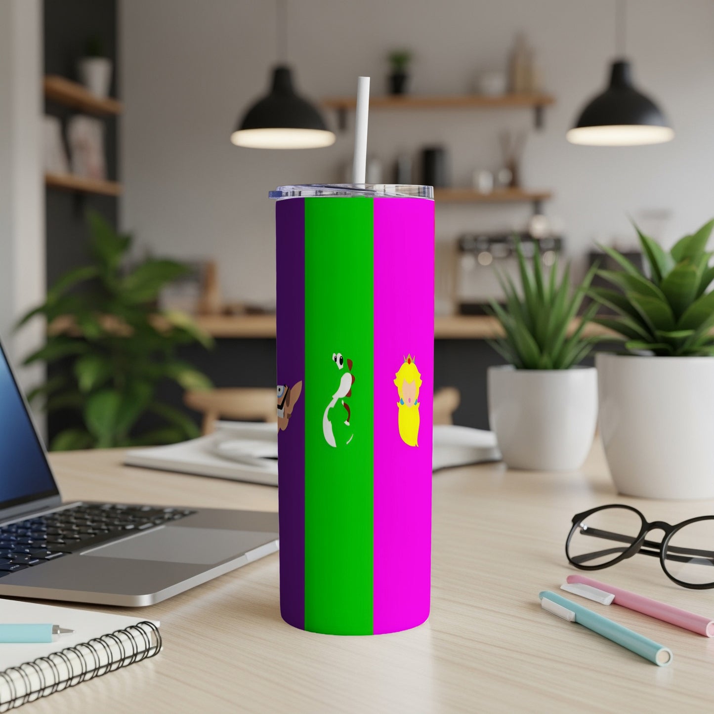 Tumbler with purple and green stripes featuring cartoon characters and a straw.