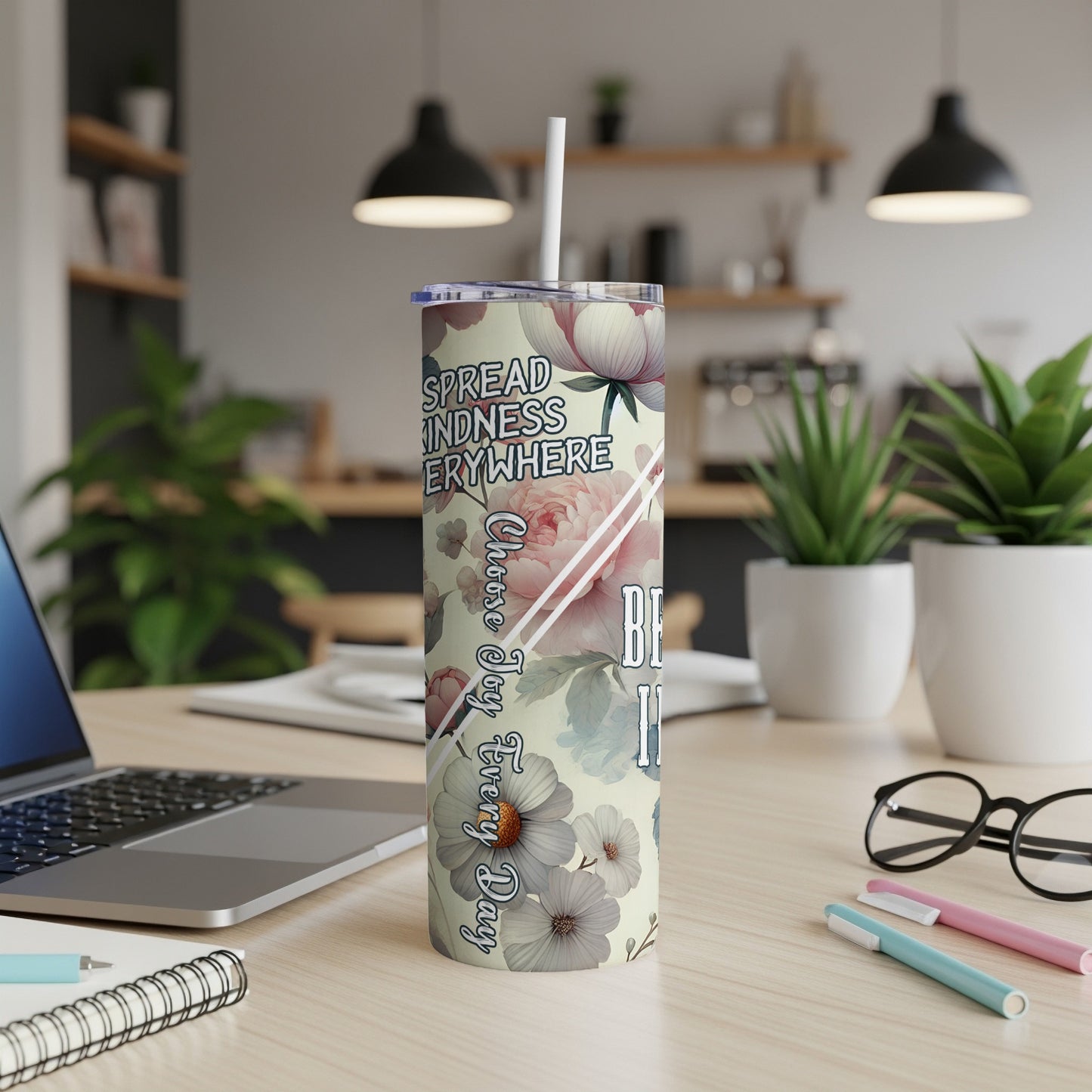 White tumbler with flowers and text "Spread Kindness Everywhere".
