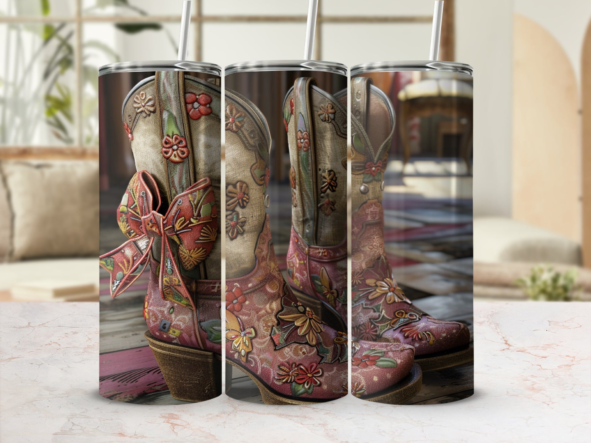 Cowboy boots with floral pattern and bow, shown on a pink wood surface.