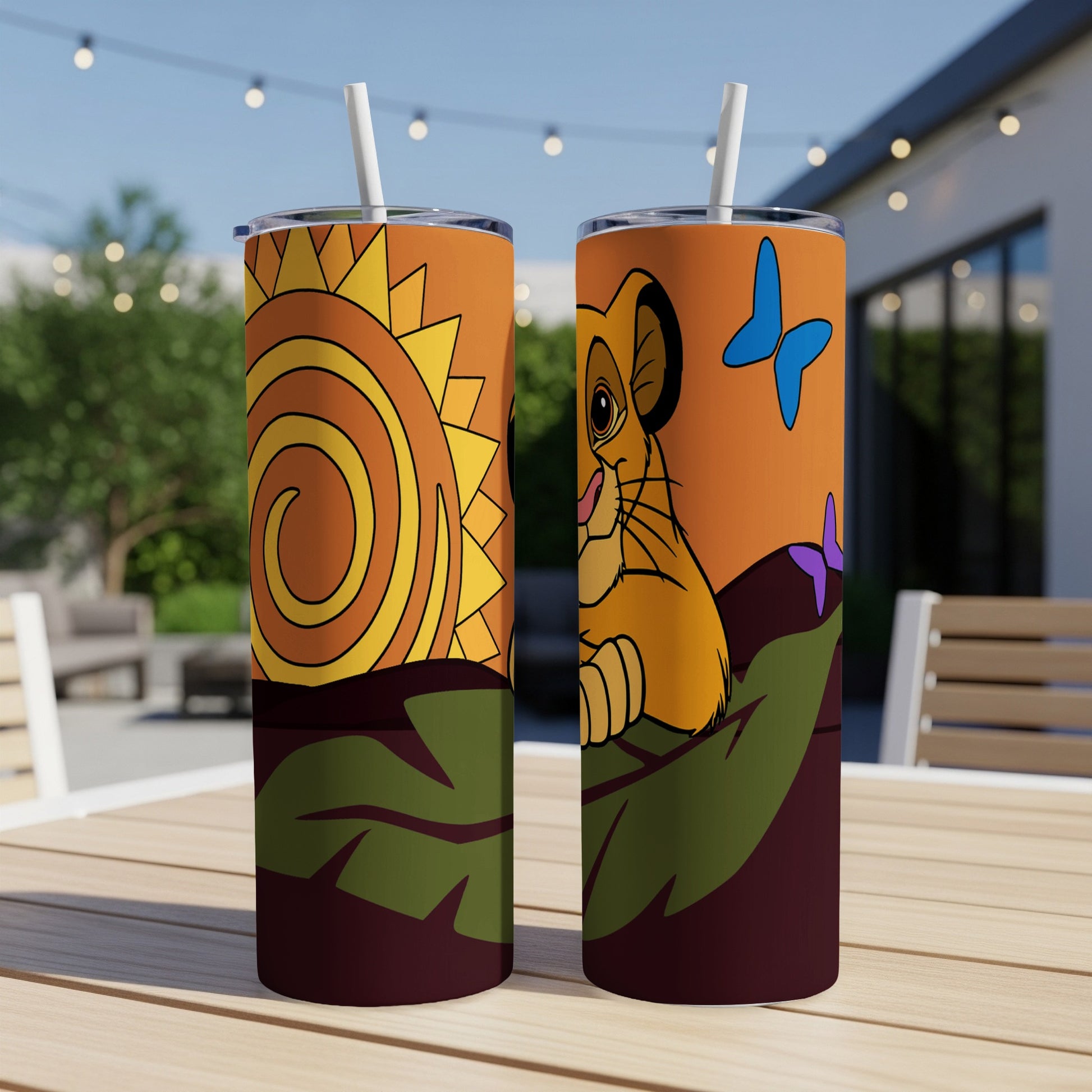 Simba from The Lion King on a tumbler with a sun and butterfly design.
