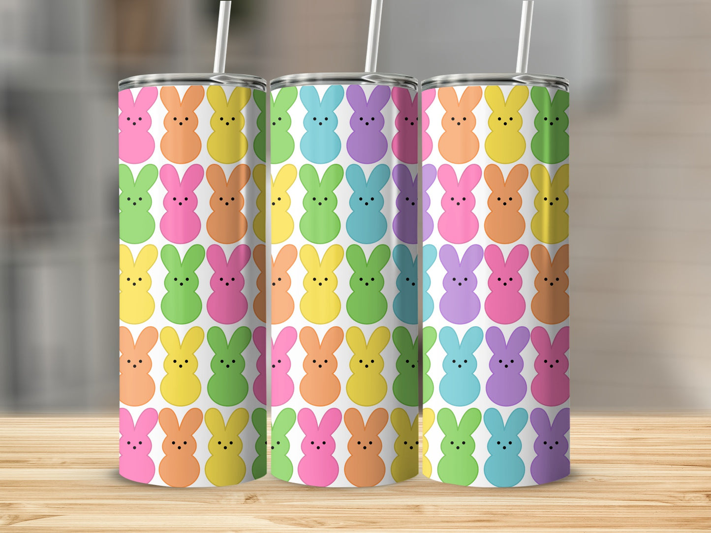 Colorful Peeps bunny pattern on three white tumblers with straws.