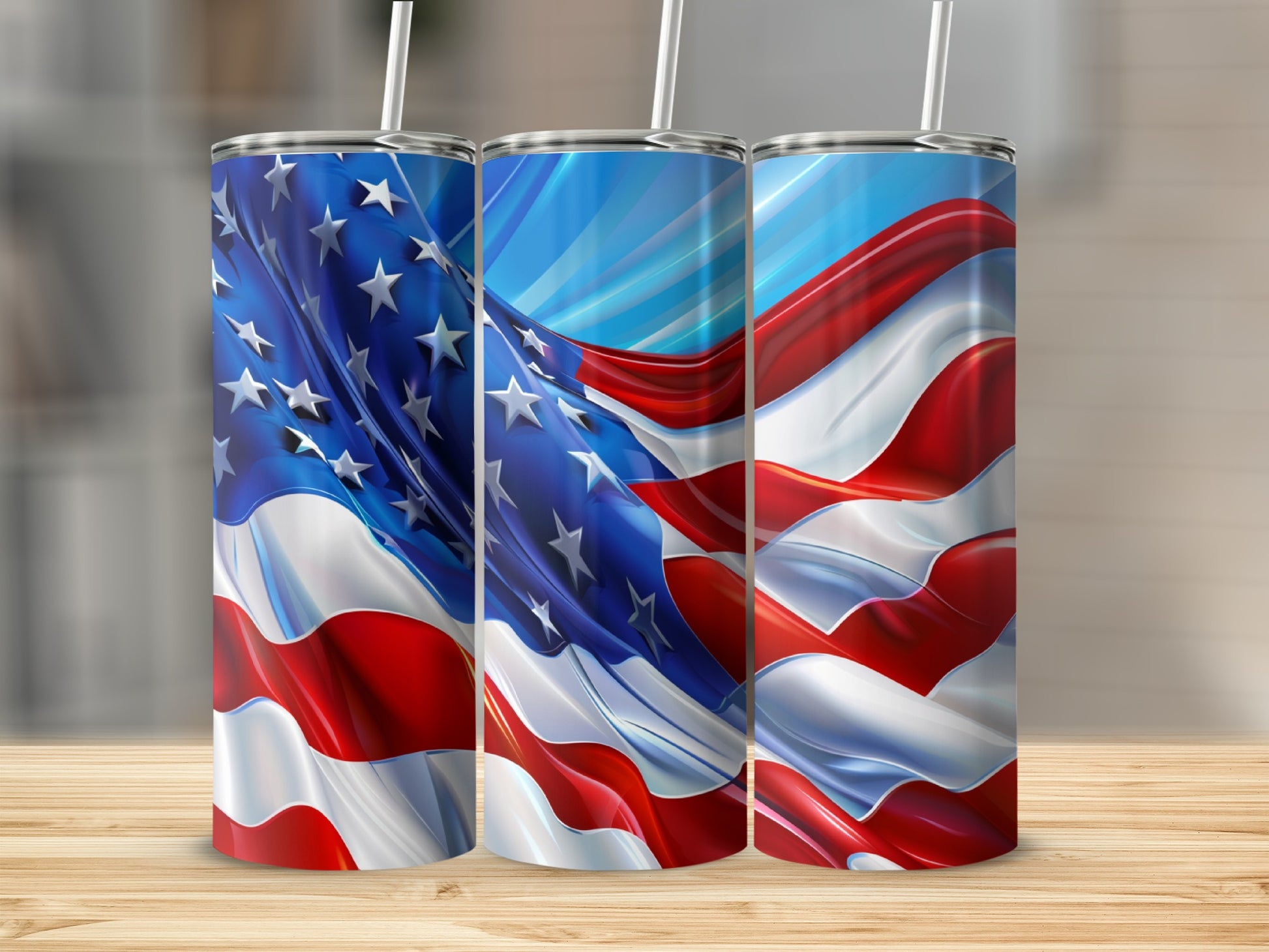Three tumblers with American flag design and striped straws.