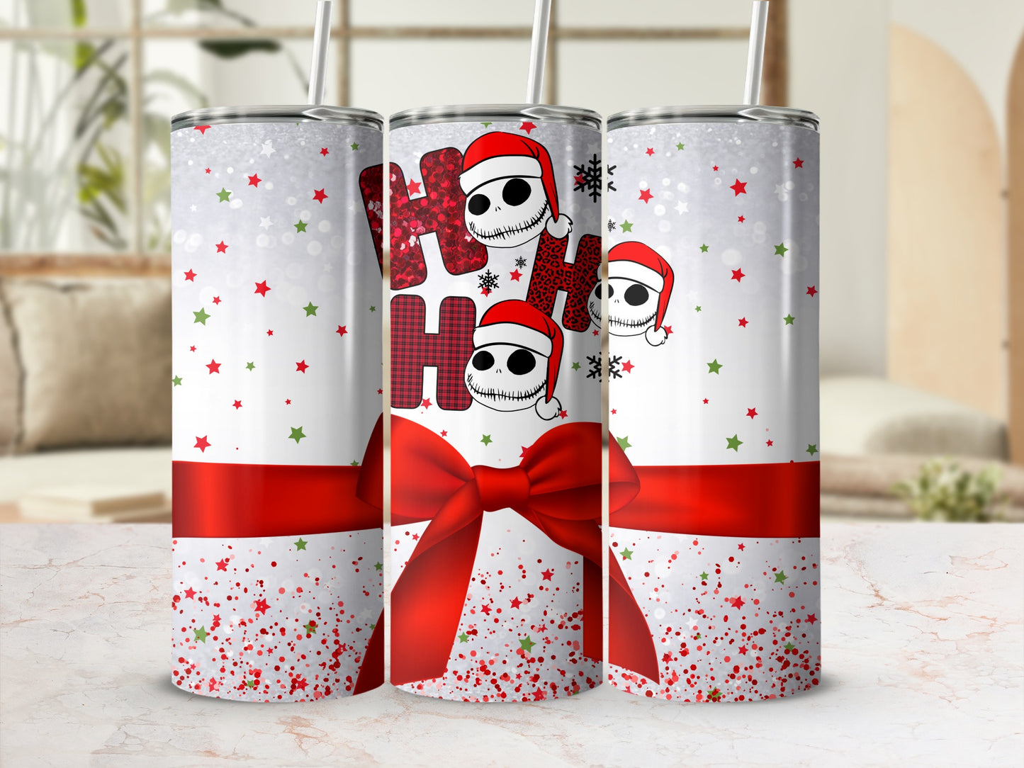 White tumbler with red ribbon and Jack Skellington "Ho Ho Ho" Christmas pattern.