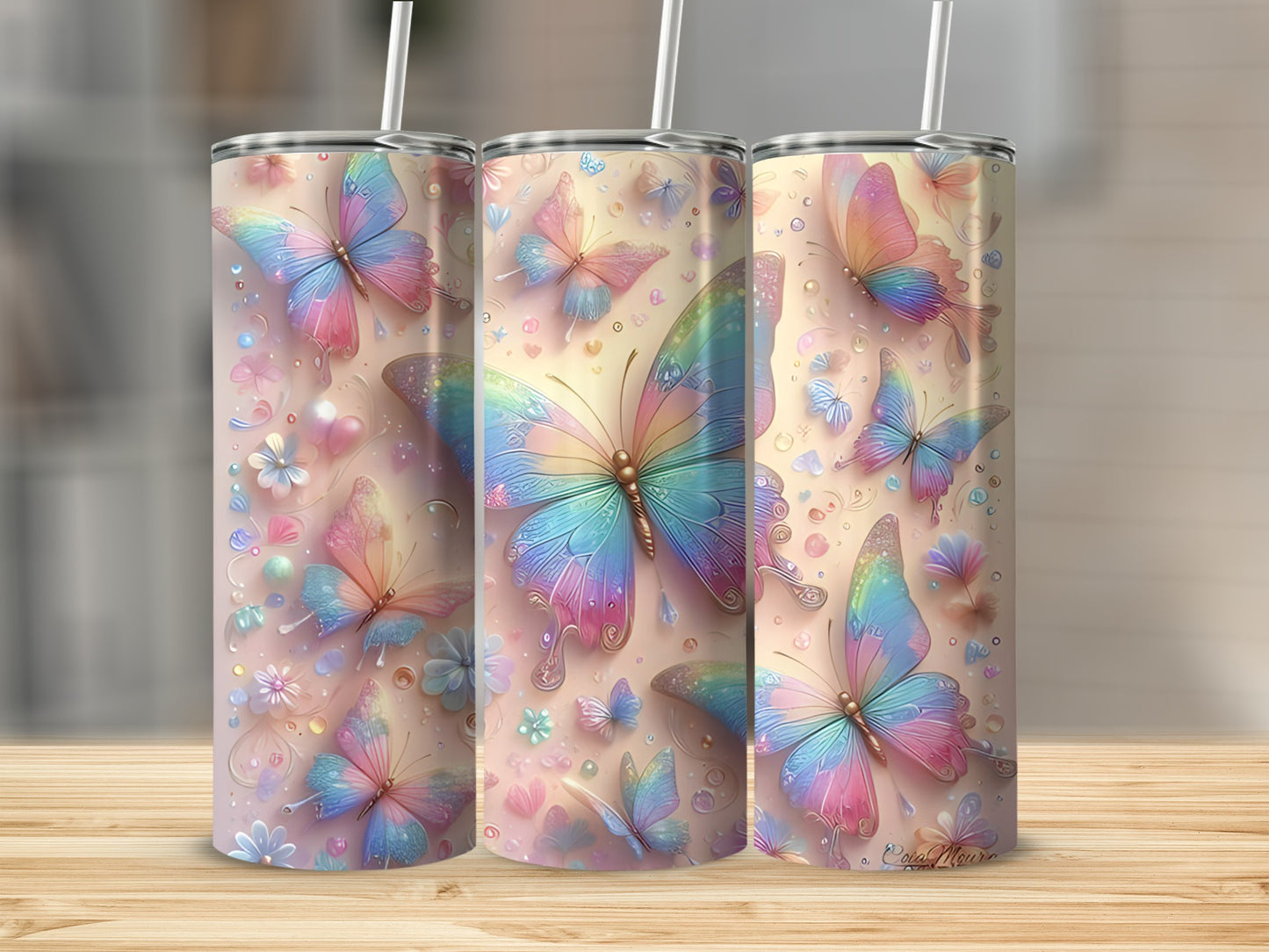 Three tumblers with iridescent butterflies and floral accents.