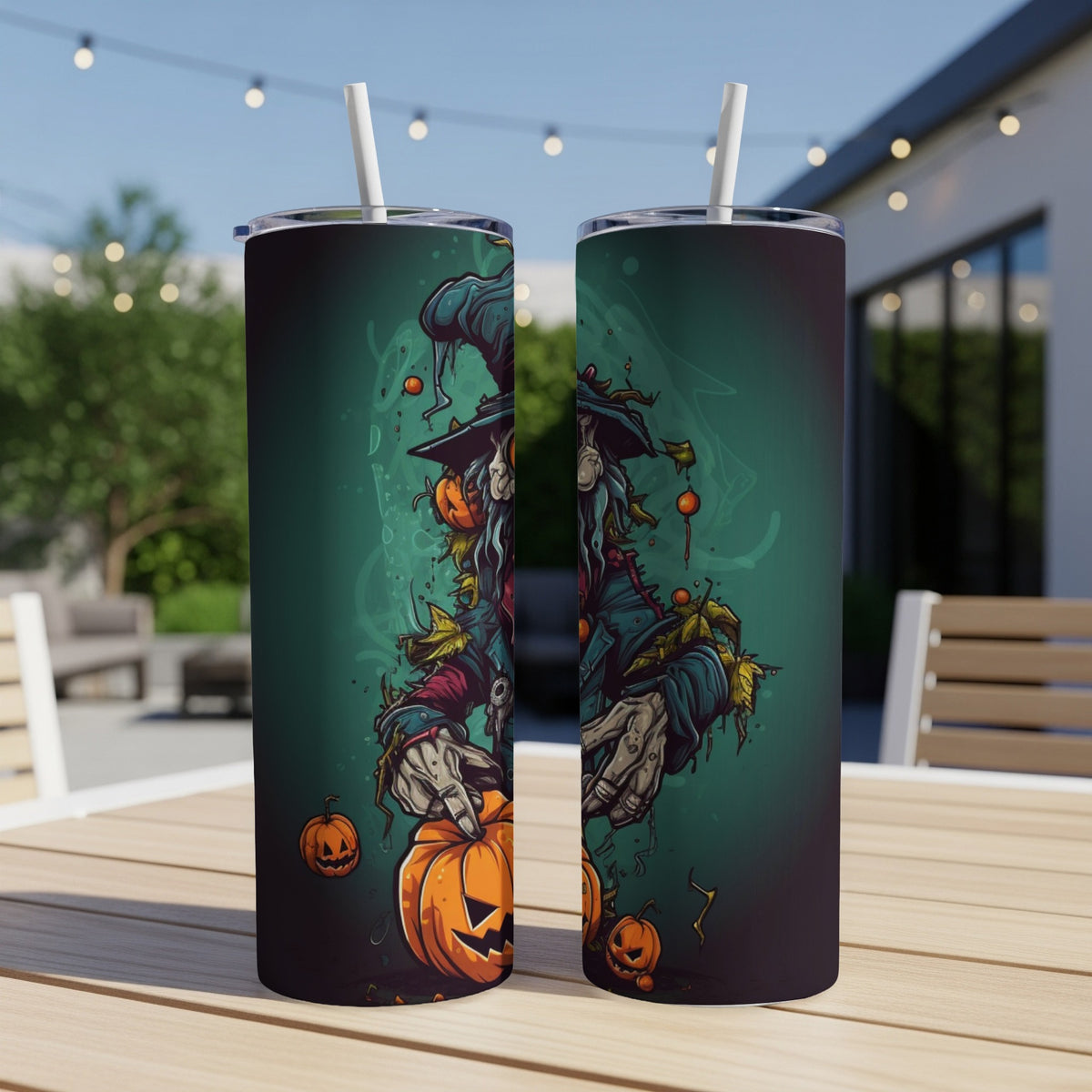 Halloween tumbler with a scarecrow holding a pumpkin and smaller pumpkins.