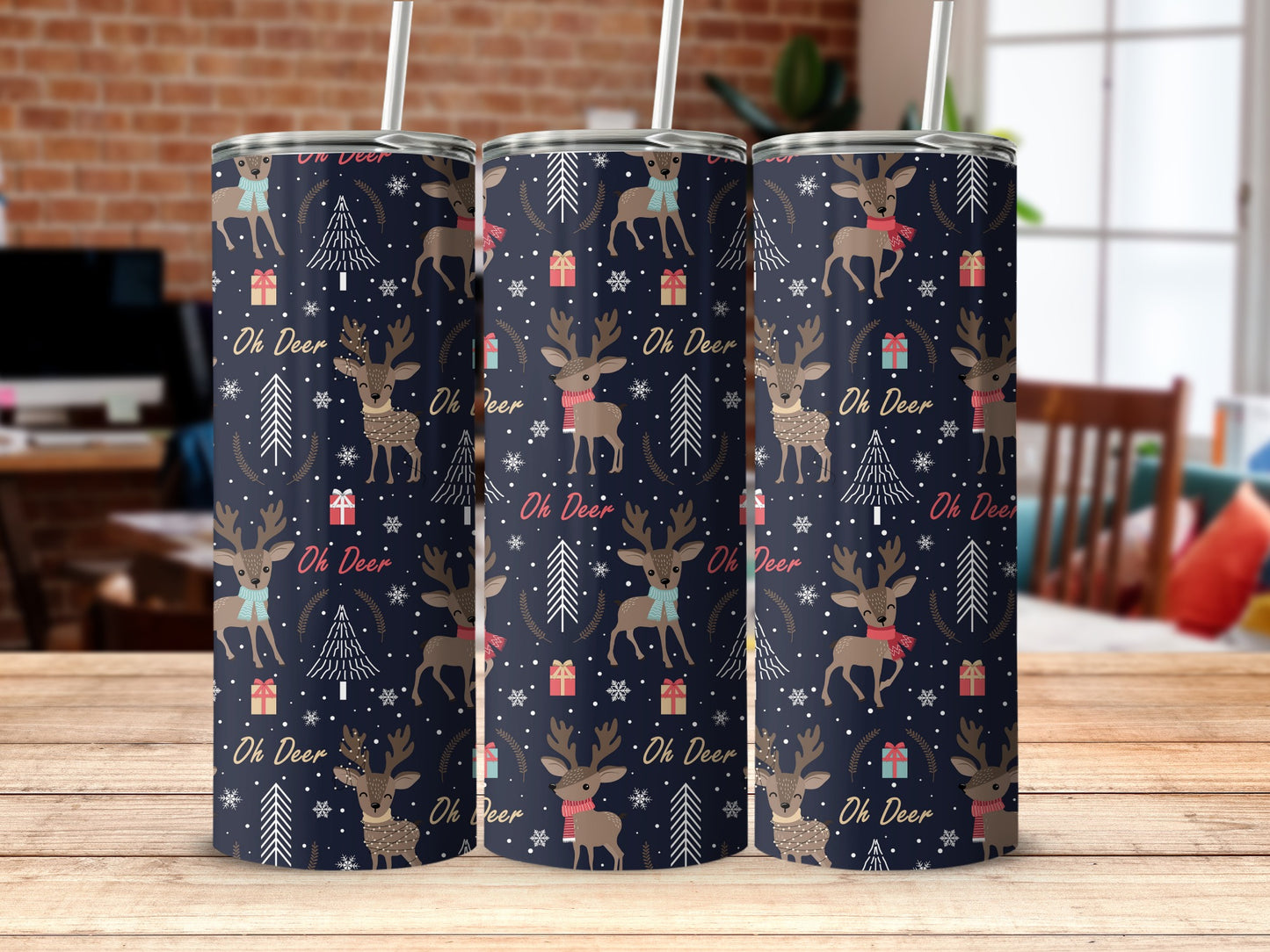 Tumbler with a repeating pattern of deer, snowflakes, and pine trees.