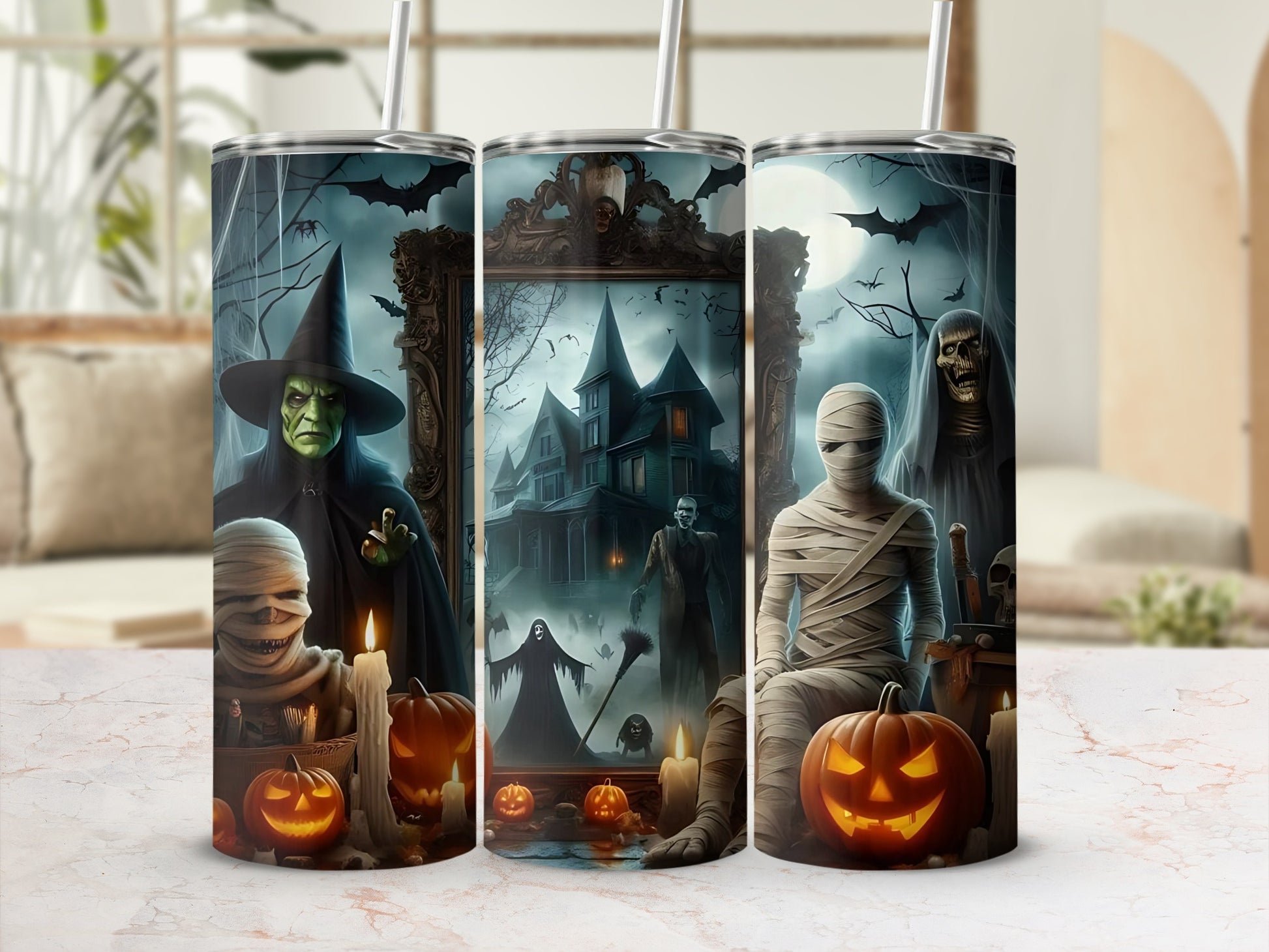 Halloween tumblers with a witch, mummy, ghost, haunted house, and pumpkins.