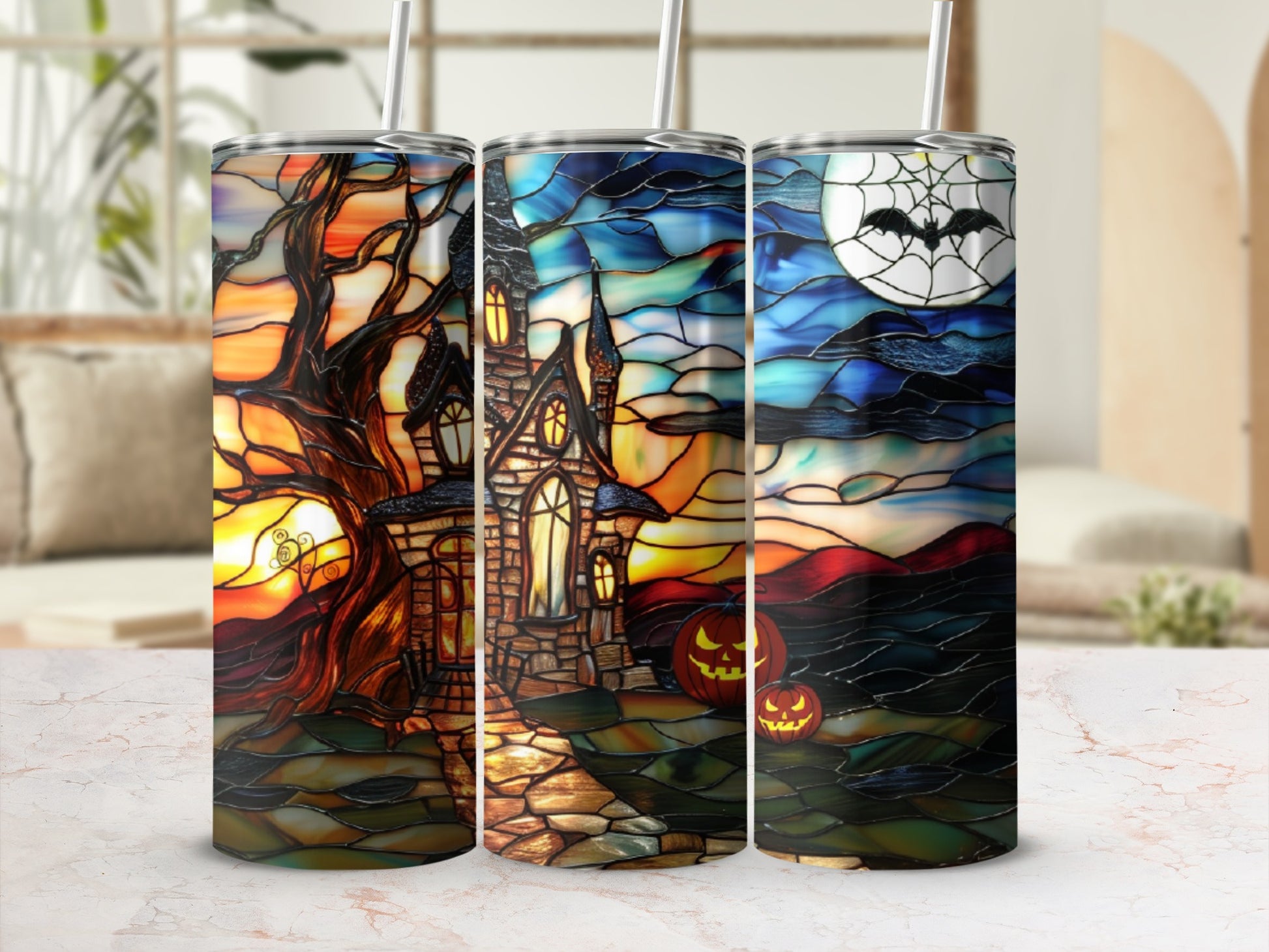 Three tumblers with stained-glass Halloween scenes: haunted house, pumpkins, moon.