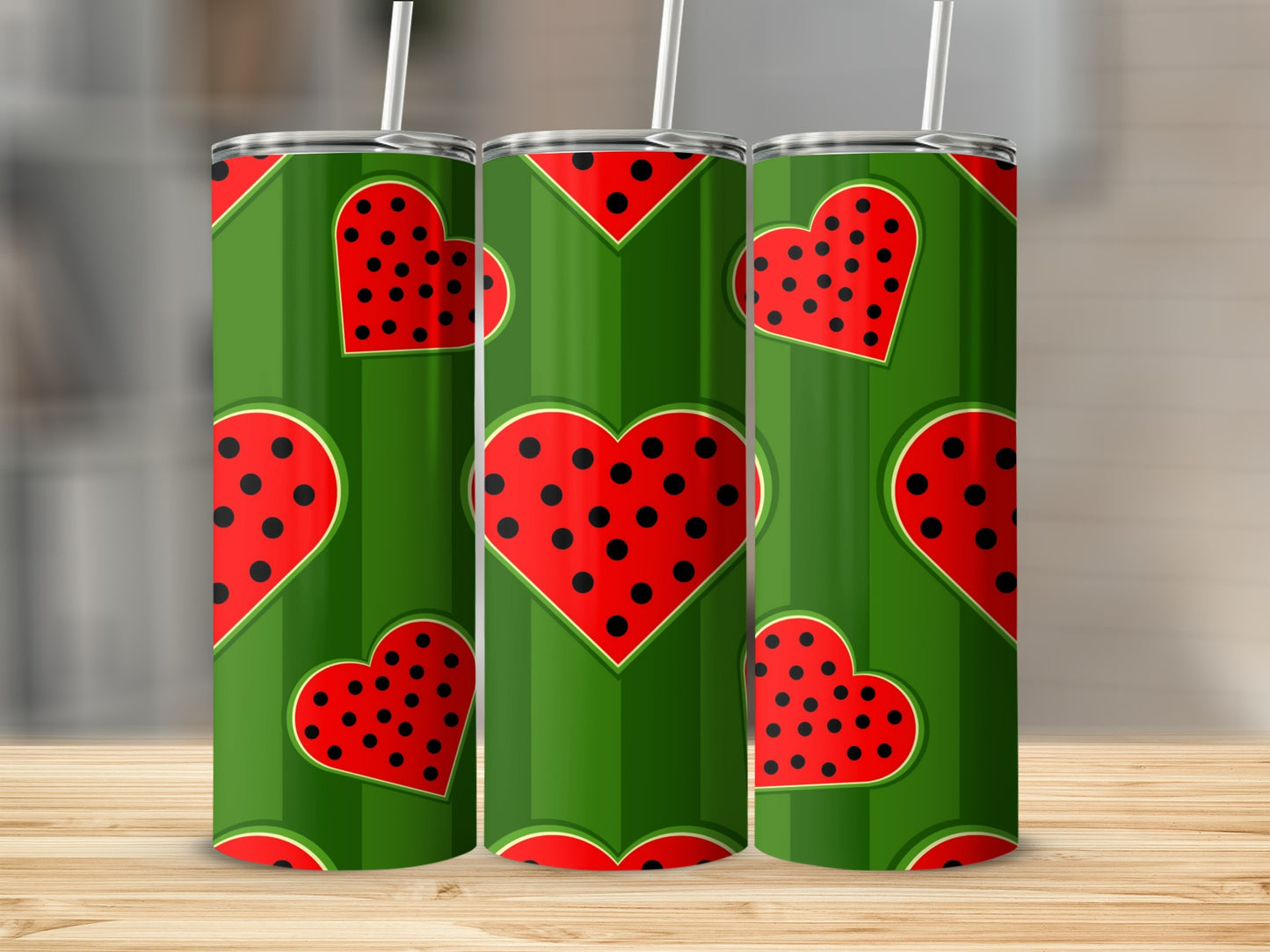 Green tumbler with watermelon heart pattern and black polka dots.