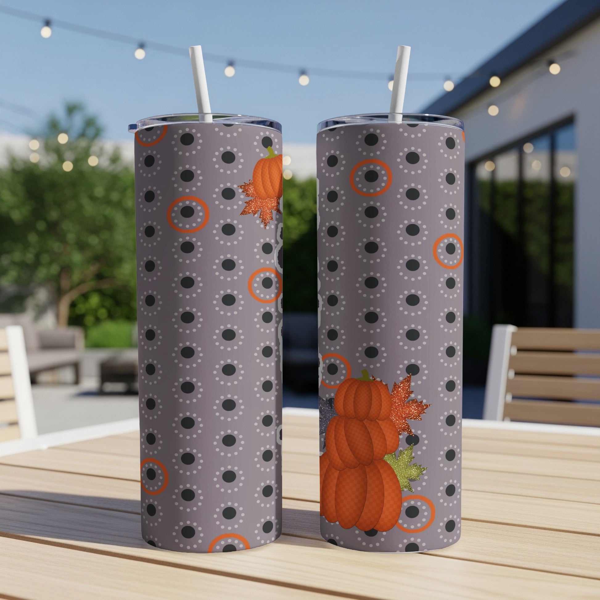 Two tall tumblers with pumpkin and polka dot pattern.