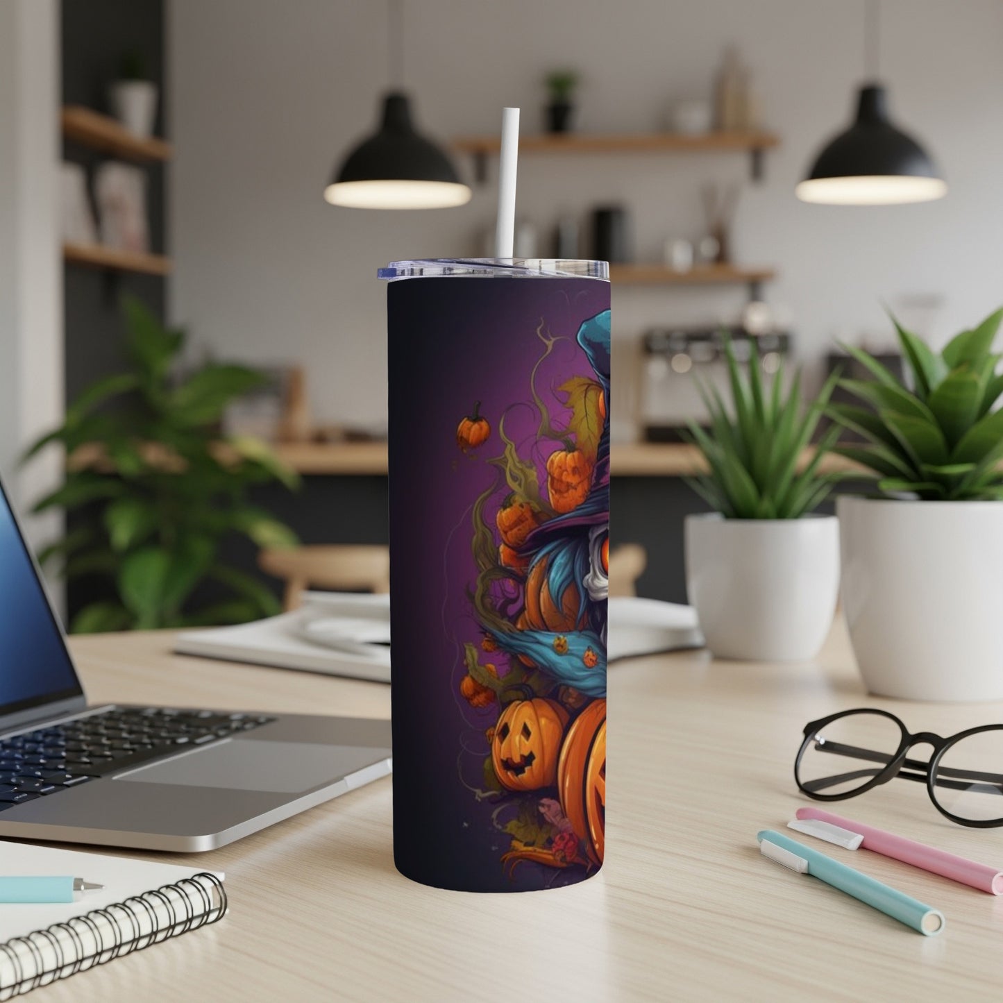 Tall tumbler with a Halloween witch and pumpkin design on a purple background.