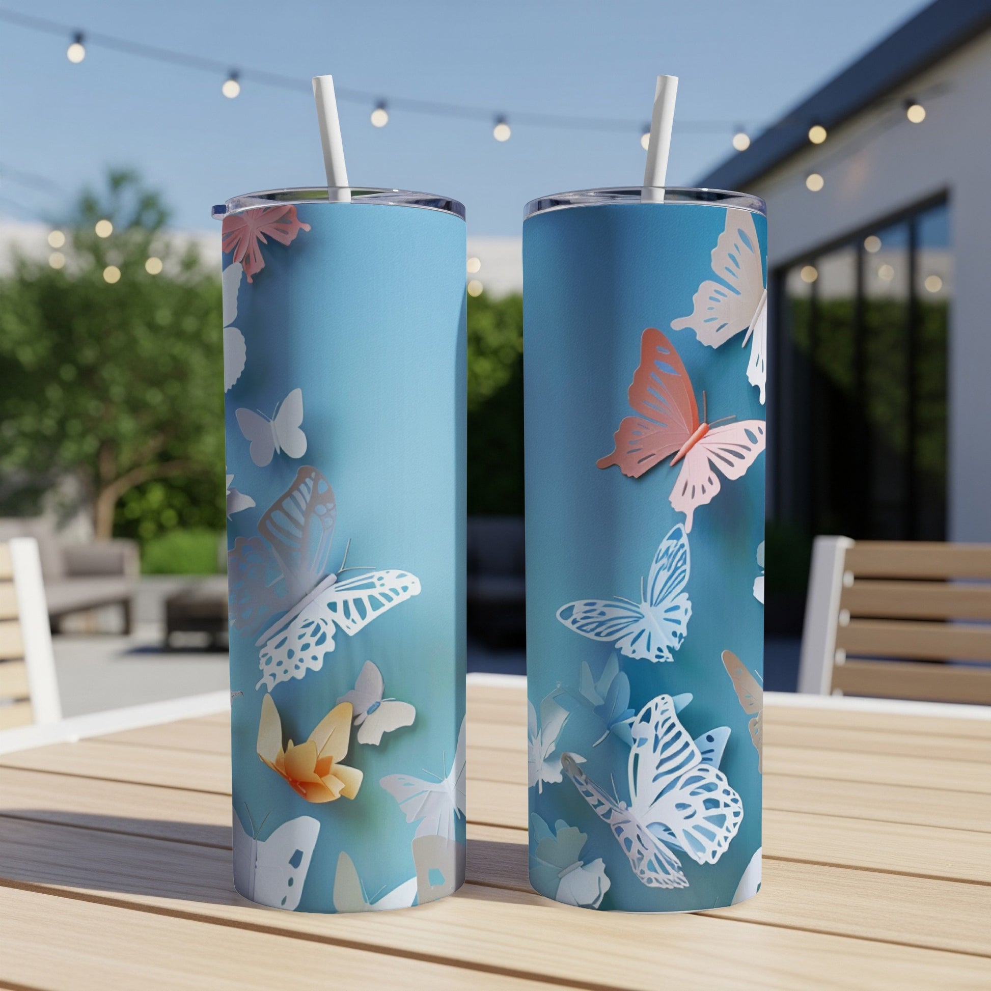 Two tall, slim tumblers with a pale blue background and a butterfly design.