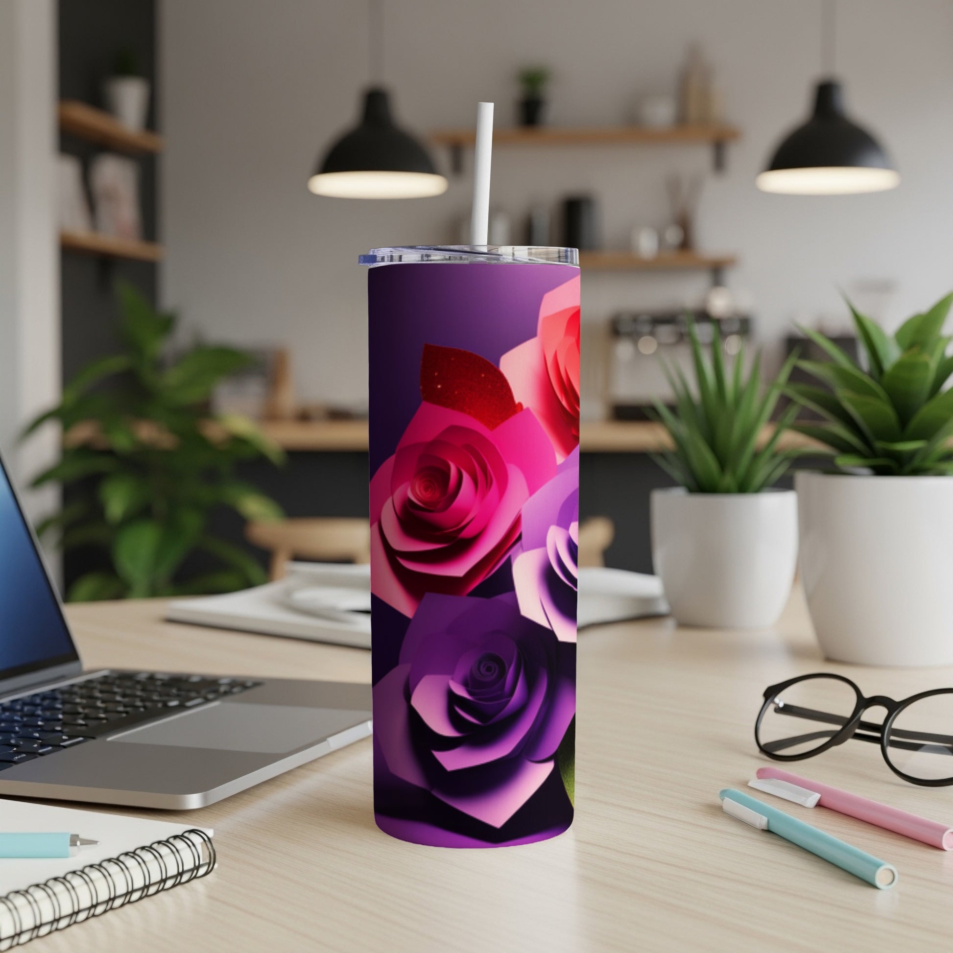 Purple and pink paper roses on a tall, slender tumbler.
