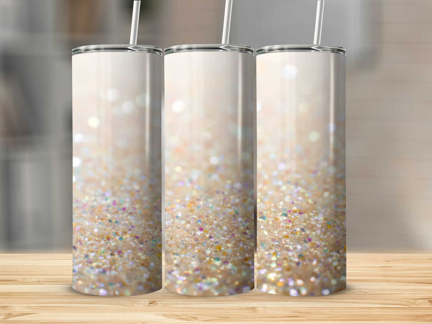 Three insulated tumblers with a shimmering glitter design.