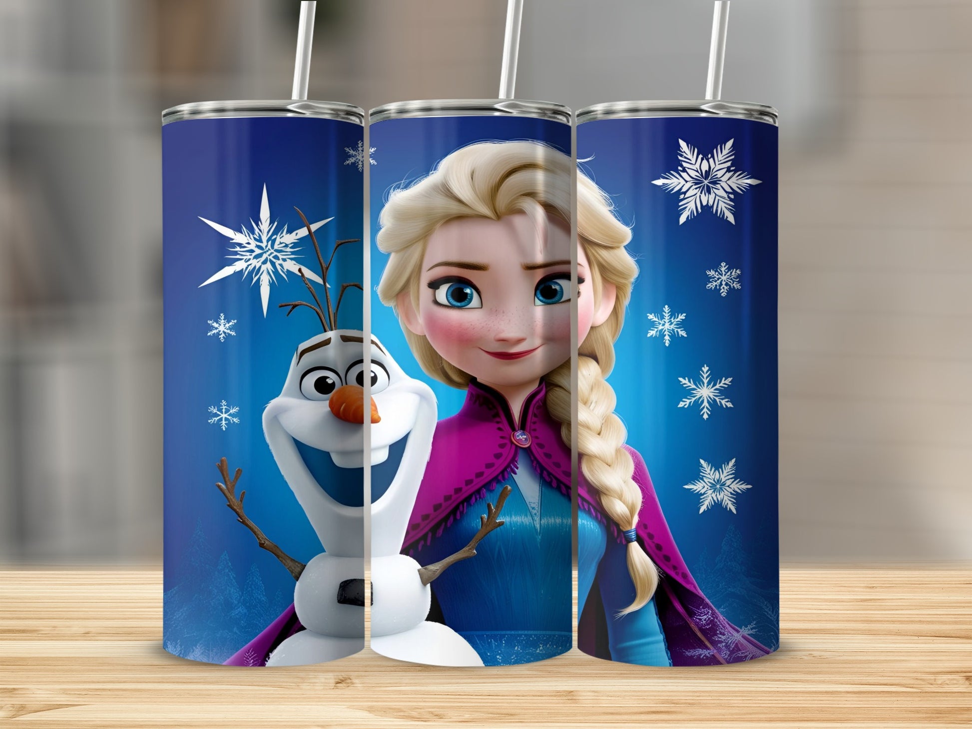Elsa and Olaf from Frozen on a blue tumbler with snowflakes.