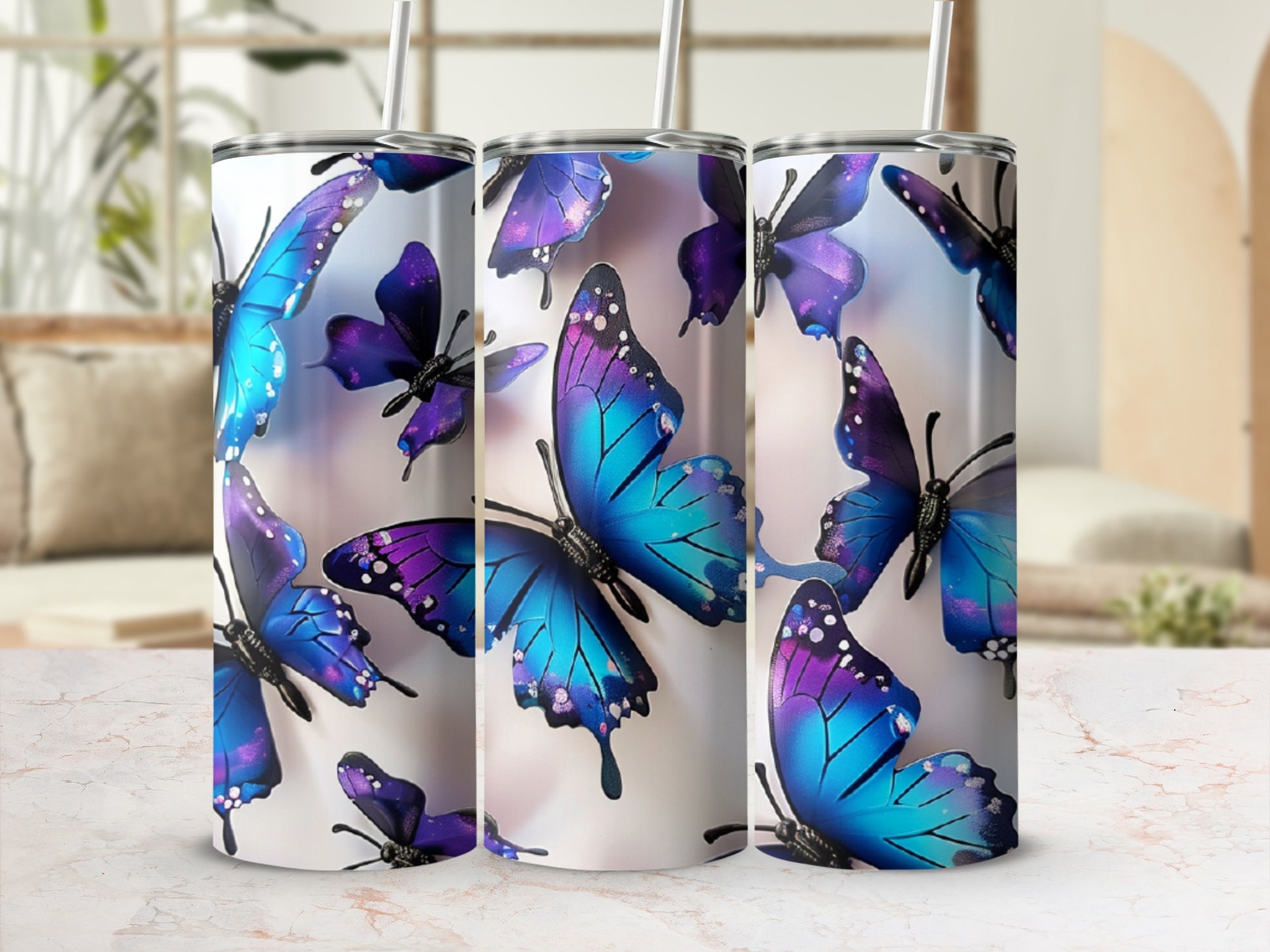 Tumbler with colorful purple and blue butterflies scattered across its surface.
